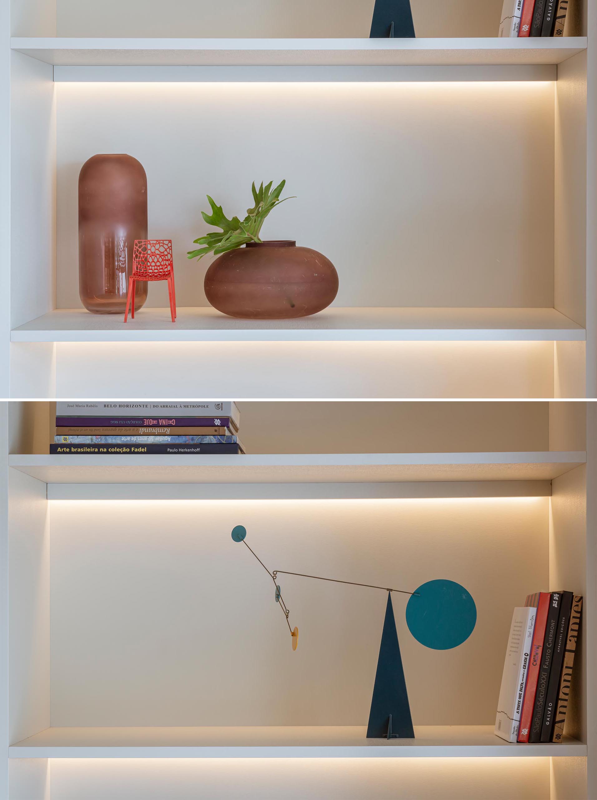 A floor-to-ceiling white shelving unit that includes hidden LED lighting.