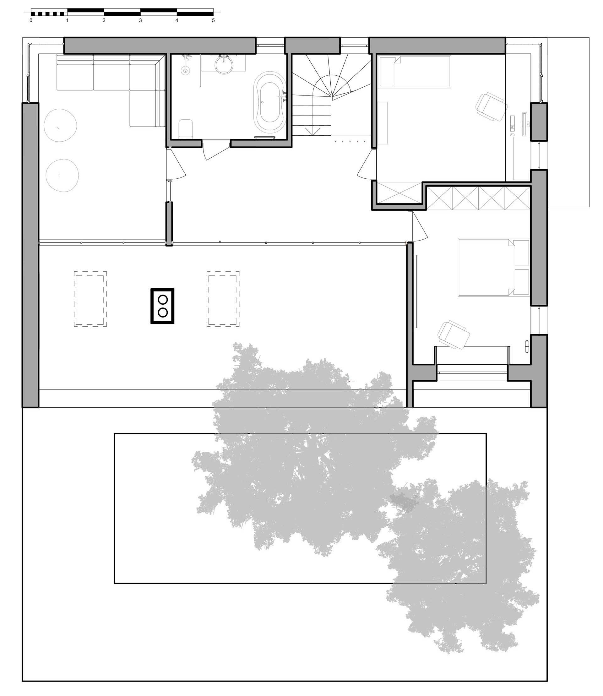 The floor plan of a modern house with a sloped green roof.