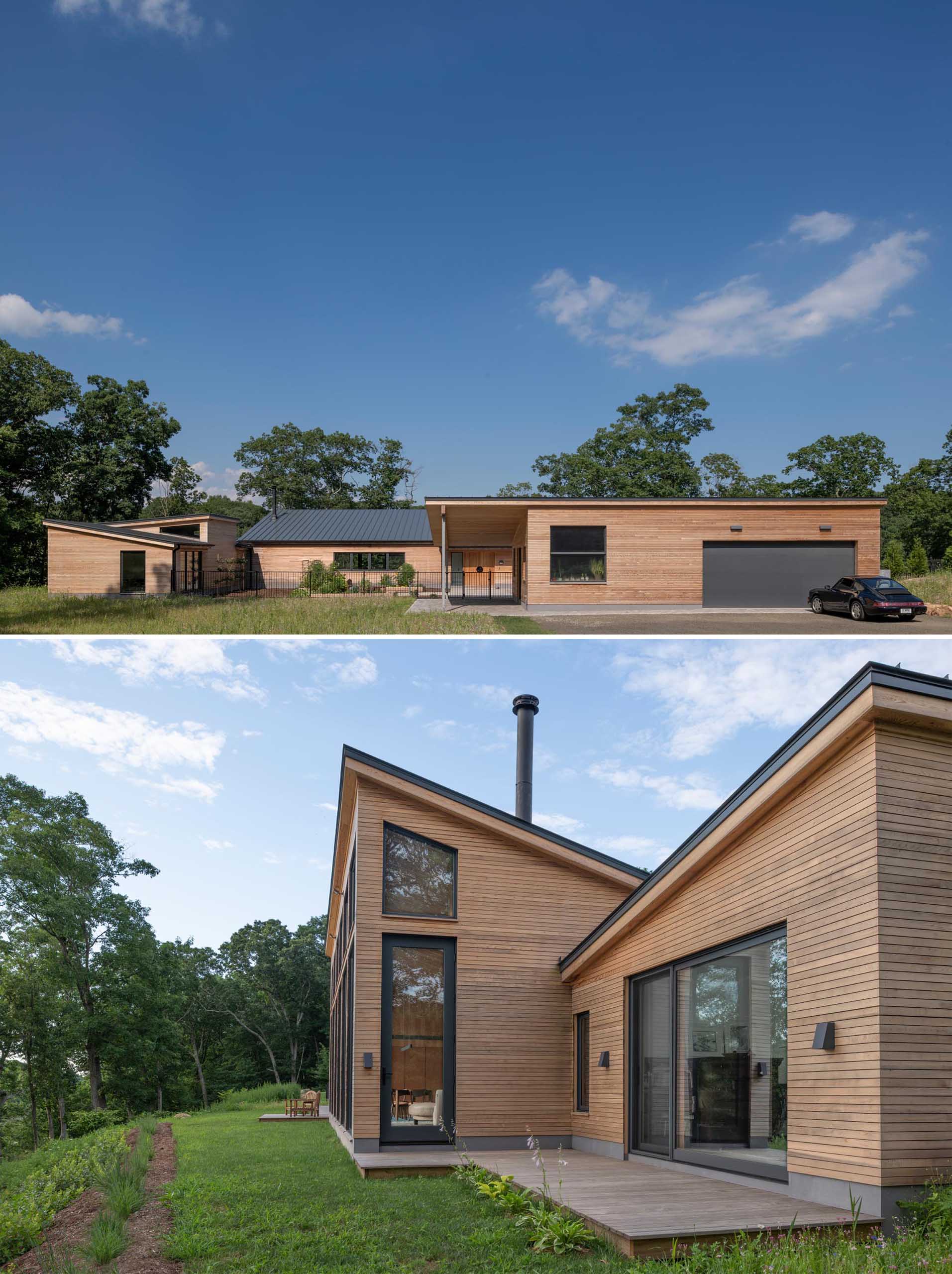 A modern house with wood siding and charcoal colored accents, like window frames, metal roof, and garage door.