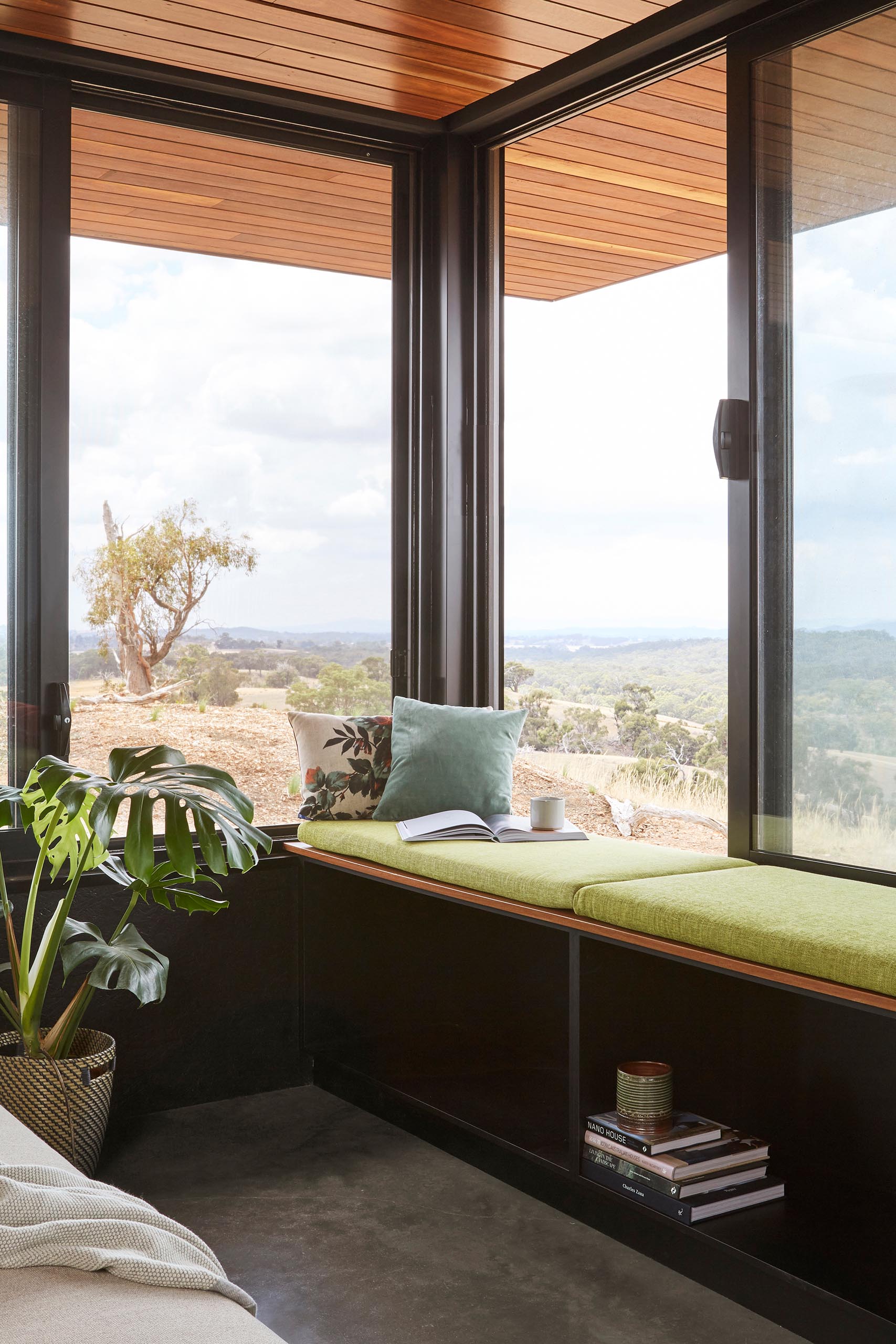 A living room with a built-in window bench.