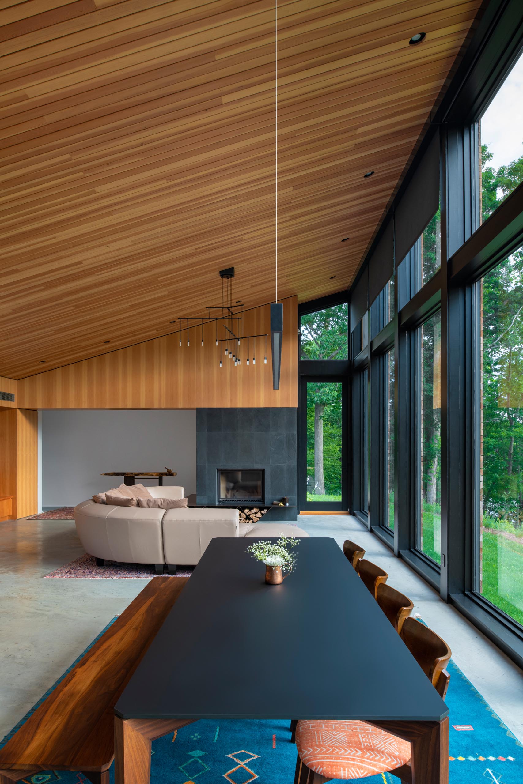 This mdoern dining area, as well as the other areas of the great room, are flooded by natural light from the wall of windows along one side of the room.