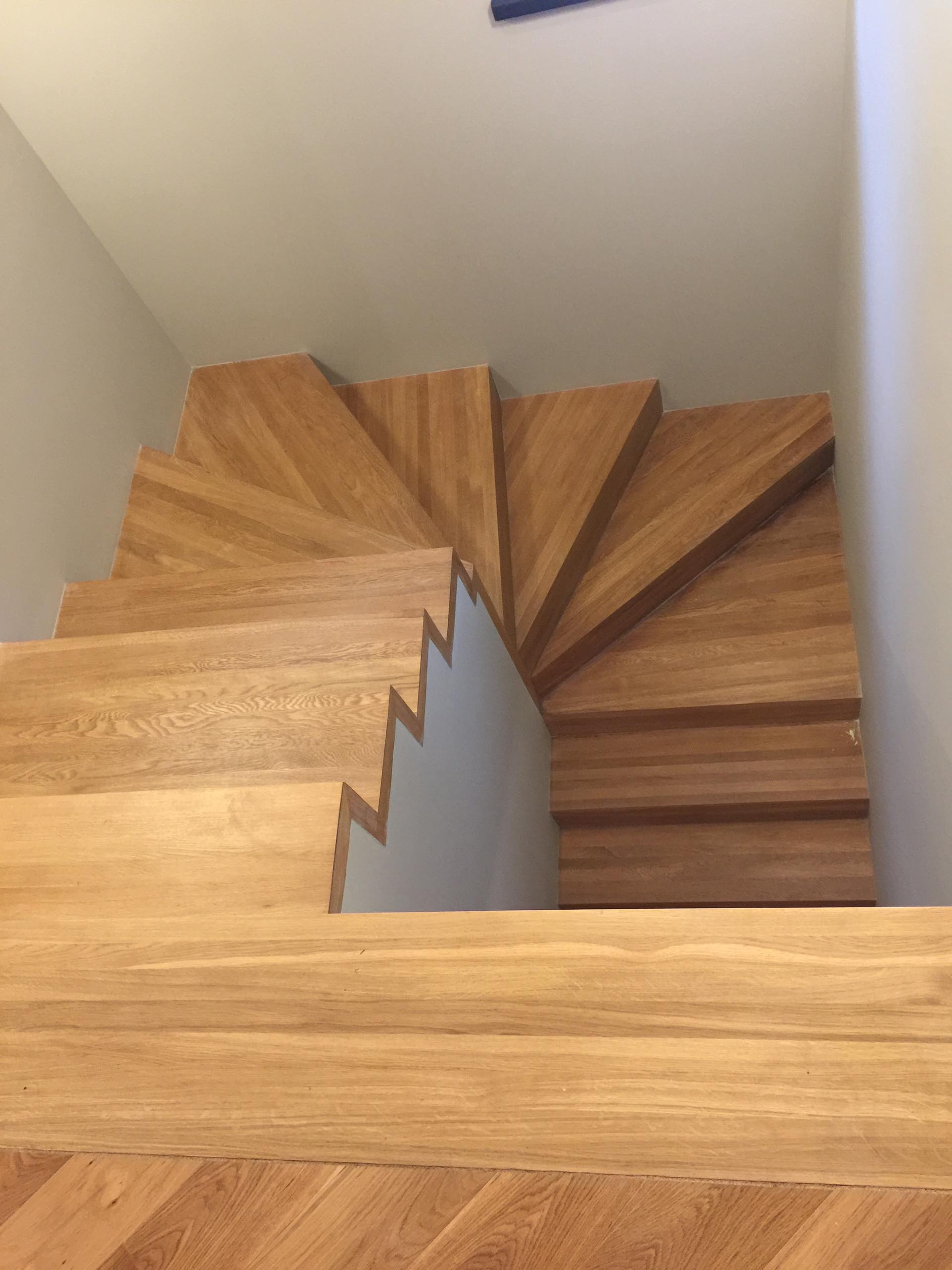 A modern home with wood stairs.