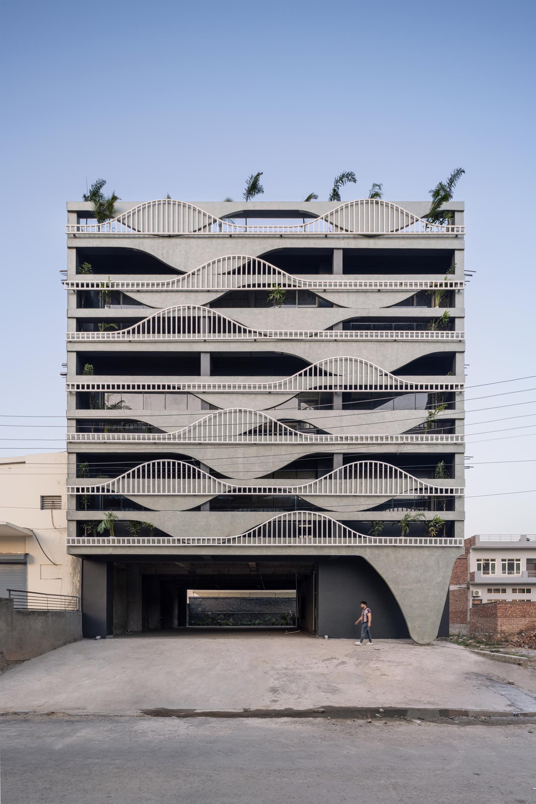 A unique building facade that's designed to look like melting concrete.
