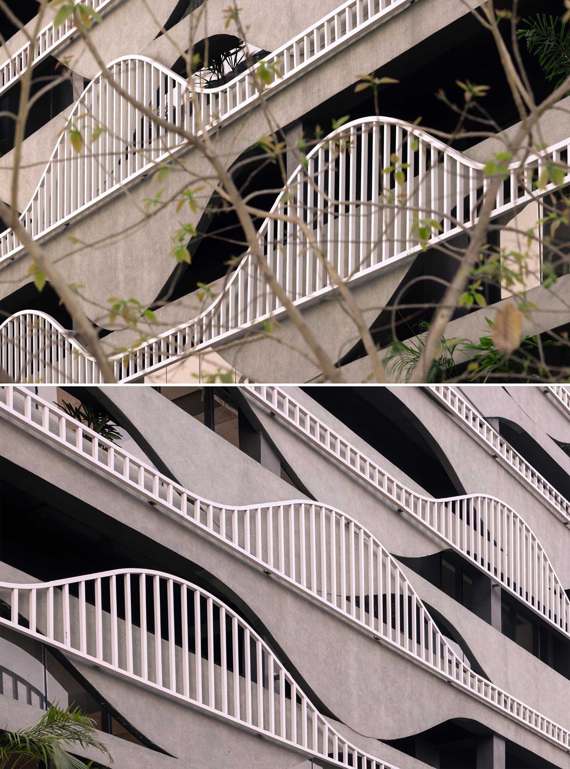 A unique building facade that's designed to look like melting concrete, with complimentary balcony railings.