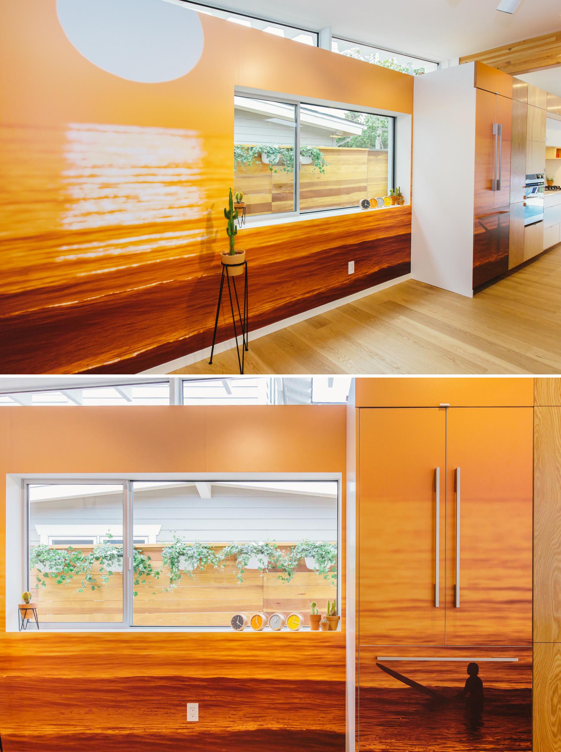 This updated living room is defined by a curved couch, built-in shelving, and a beach-inspired mural.