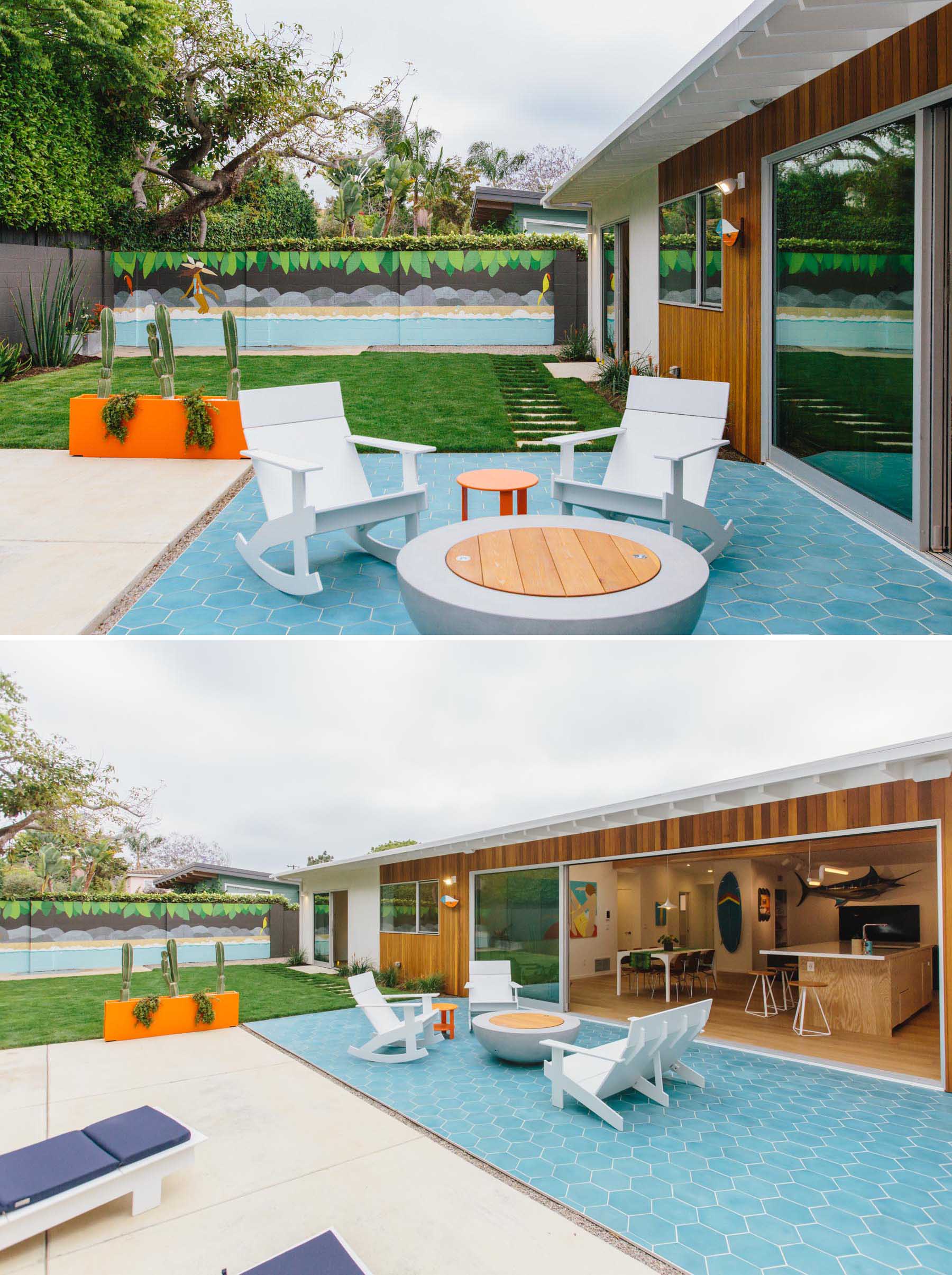 The new outdoor space includes an outdoor kitchen with built-in BBQ, a blue hexagonal tile patio, a fire bowl with lounge chairs, a colorful planter and artwork, and a grassy yard. Due to California state drought conditions, landscaping mandated low mow/drought tolerant grass, succulents, and cacti.