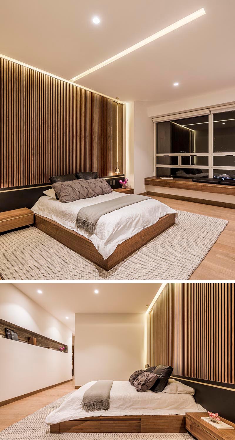 Bedroom Design Ideas - A modern bedroom with a wood slat accent wall and a ceiling that showcases hidden LED lighting.