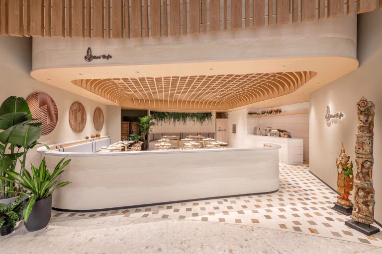 A Grid-Shaped Wood Ceiling Covers This Cafe In China