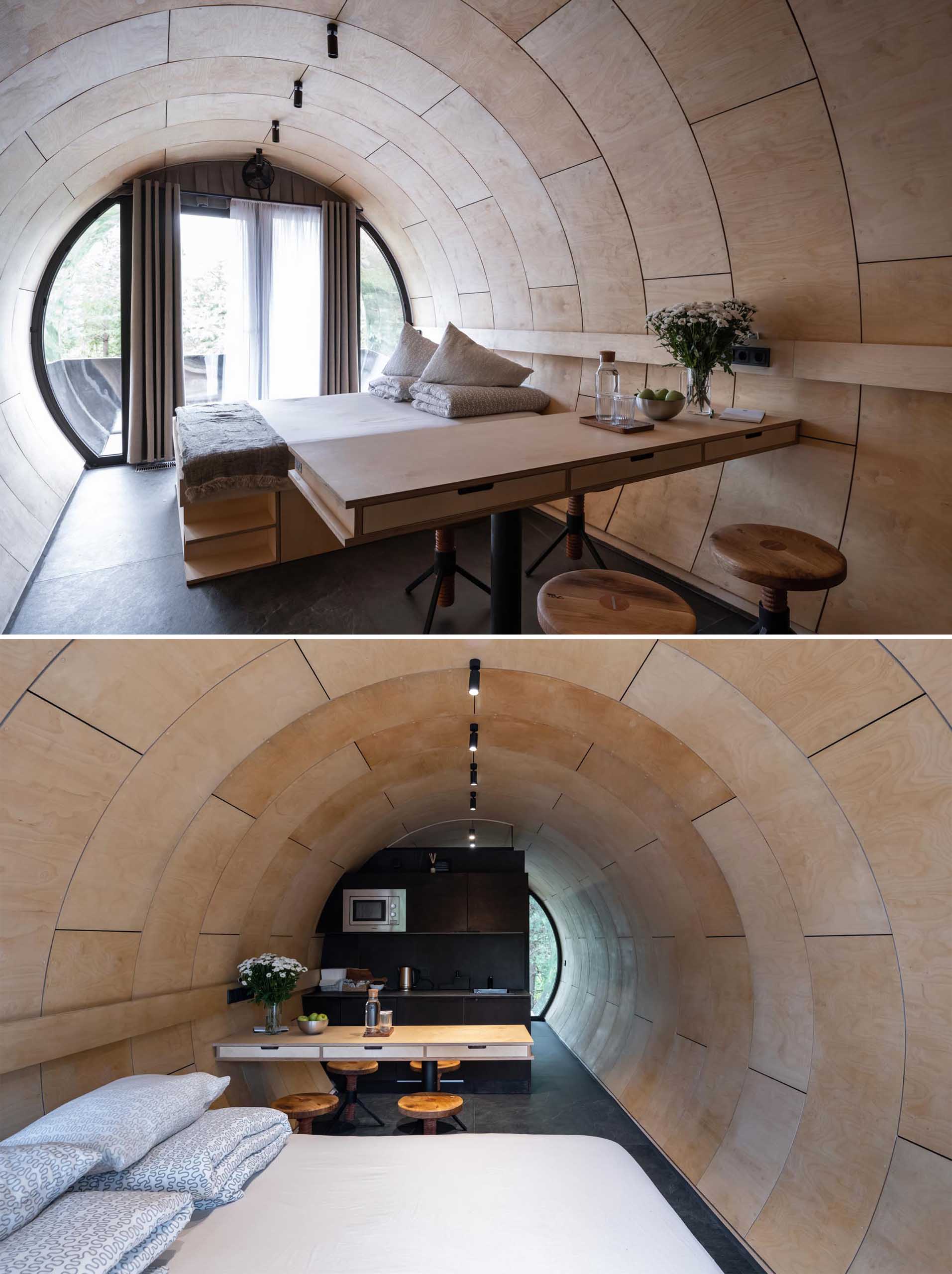 A unique tube-inspired cabin with a stainless steel exterior and a wood-lined interior.