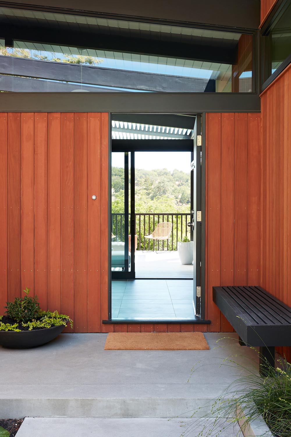 Stepping inside this remodeled home, and the entryway provides views of the valley and multiple benches.