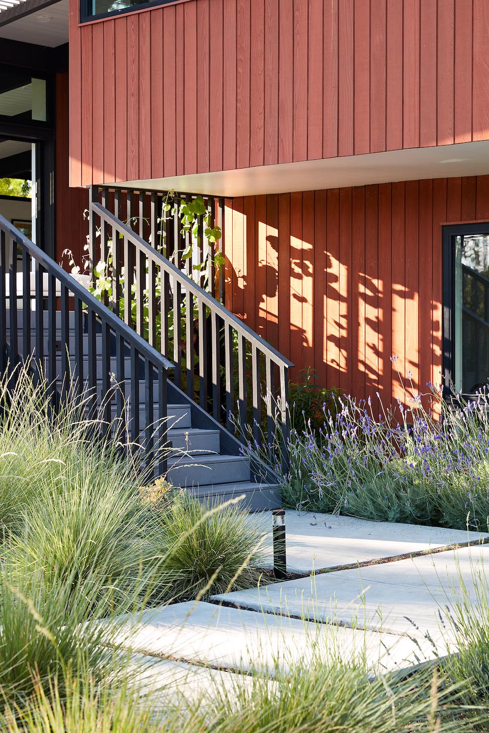 Contemporary remodel included refinishing the wood siding, and updating the stairs and pathway.