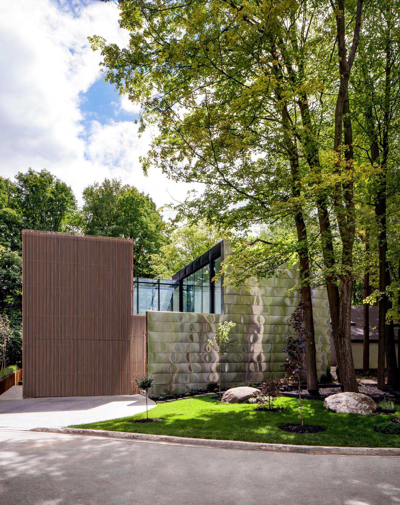 The design of this modern house includes a solid front facade, with a tucked away entryway, that afforded the client the privacy they desired.