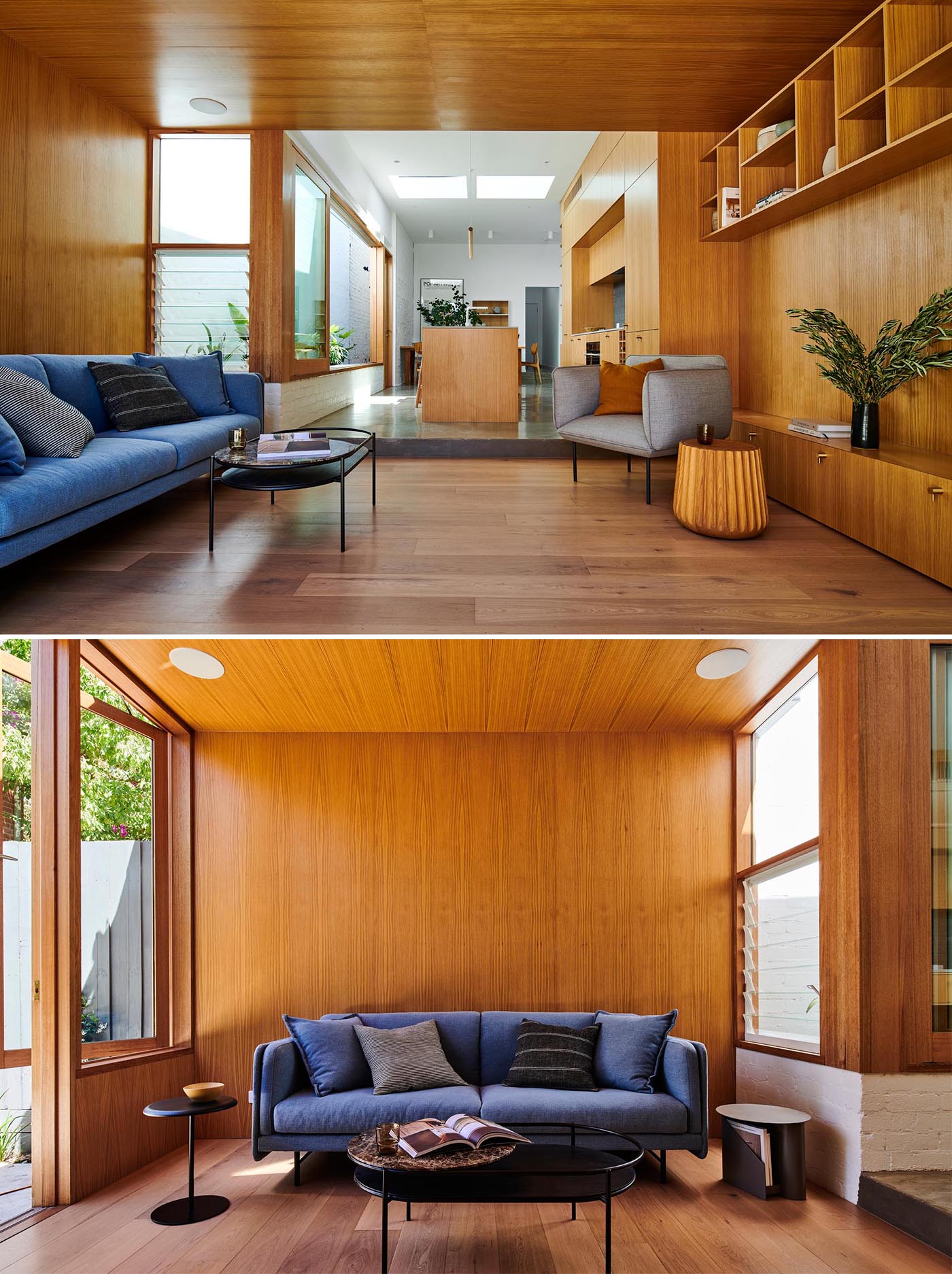 A modern sitting area, which opens to the backyard, includes wood walls, louver windows, shelving, and a colorful blue couch.