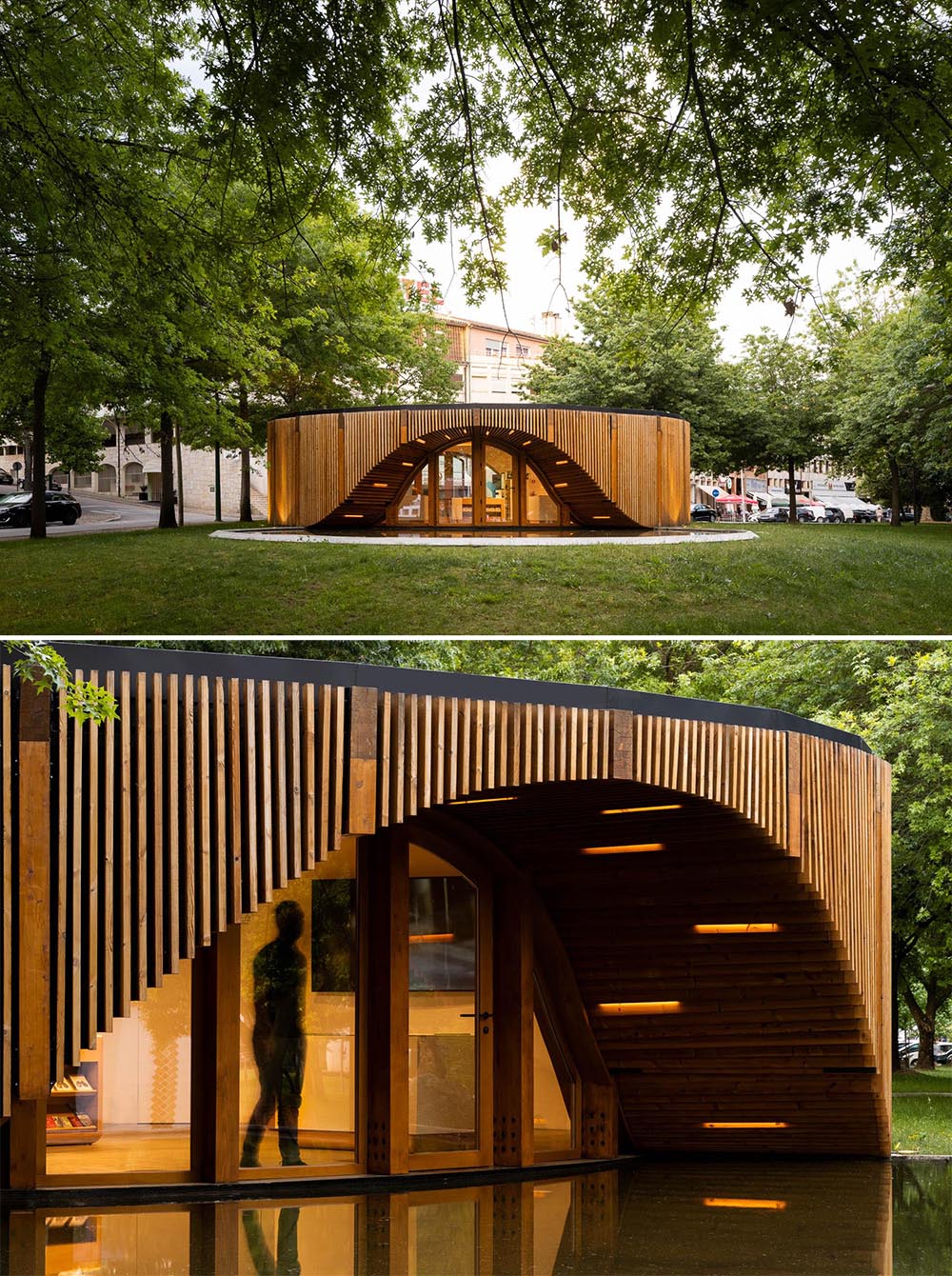 At night, lights line the curves of this modern round building, highlighting the entryway and the reflecting pool.