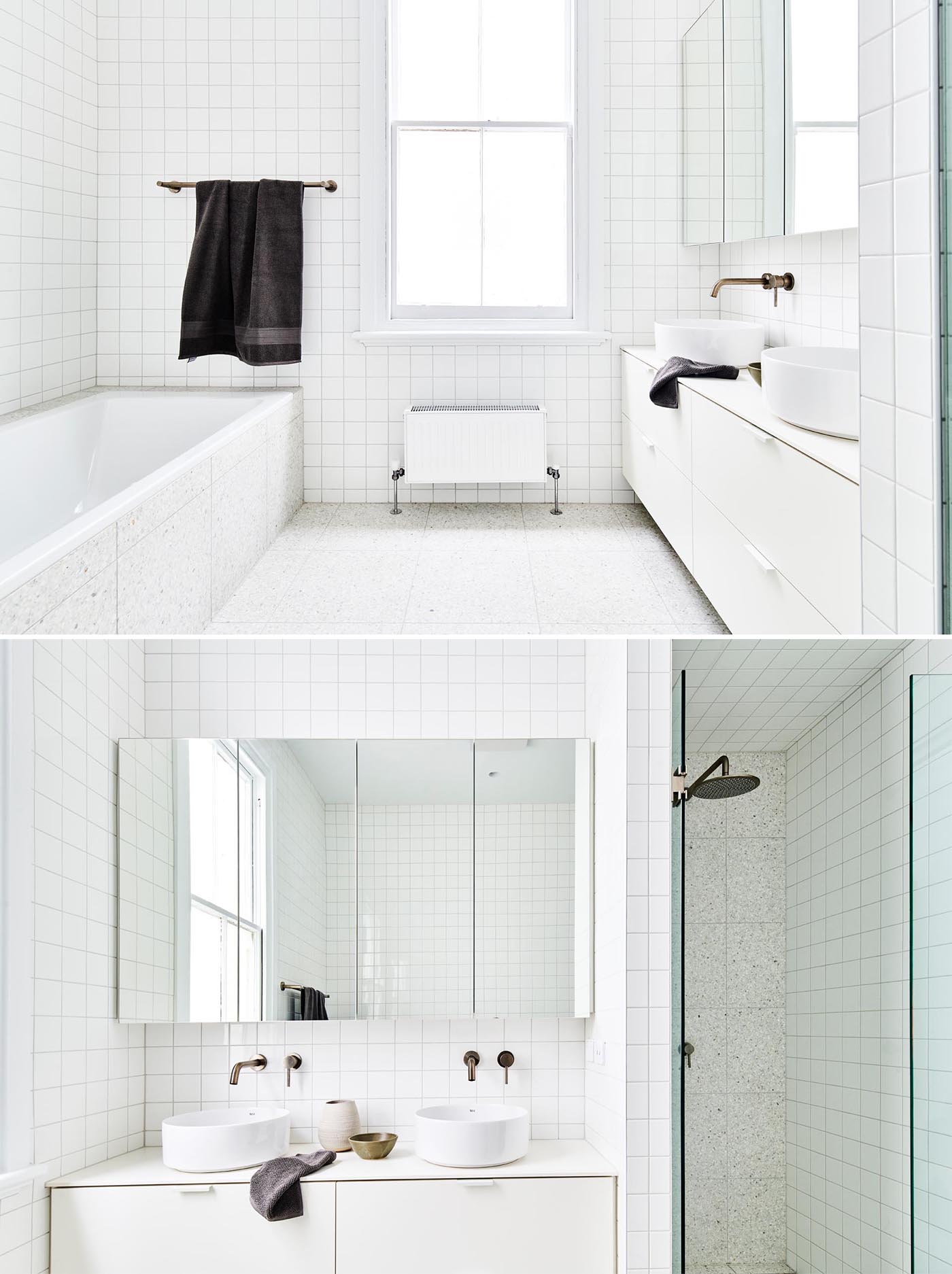 A modern white bathroom with square tiles.