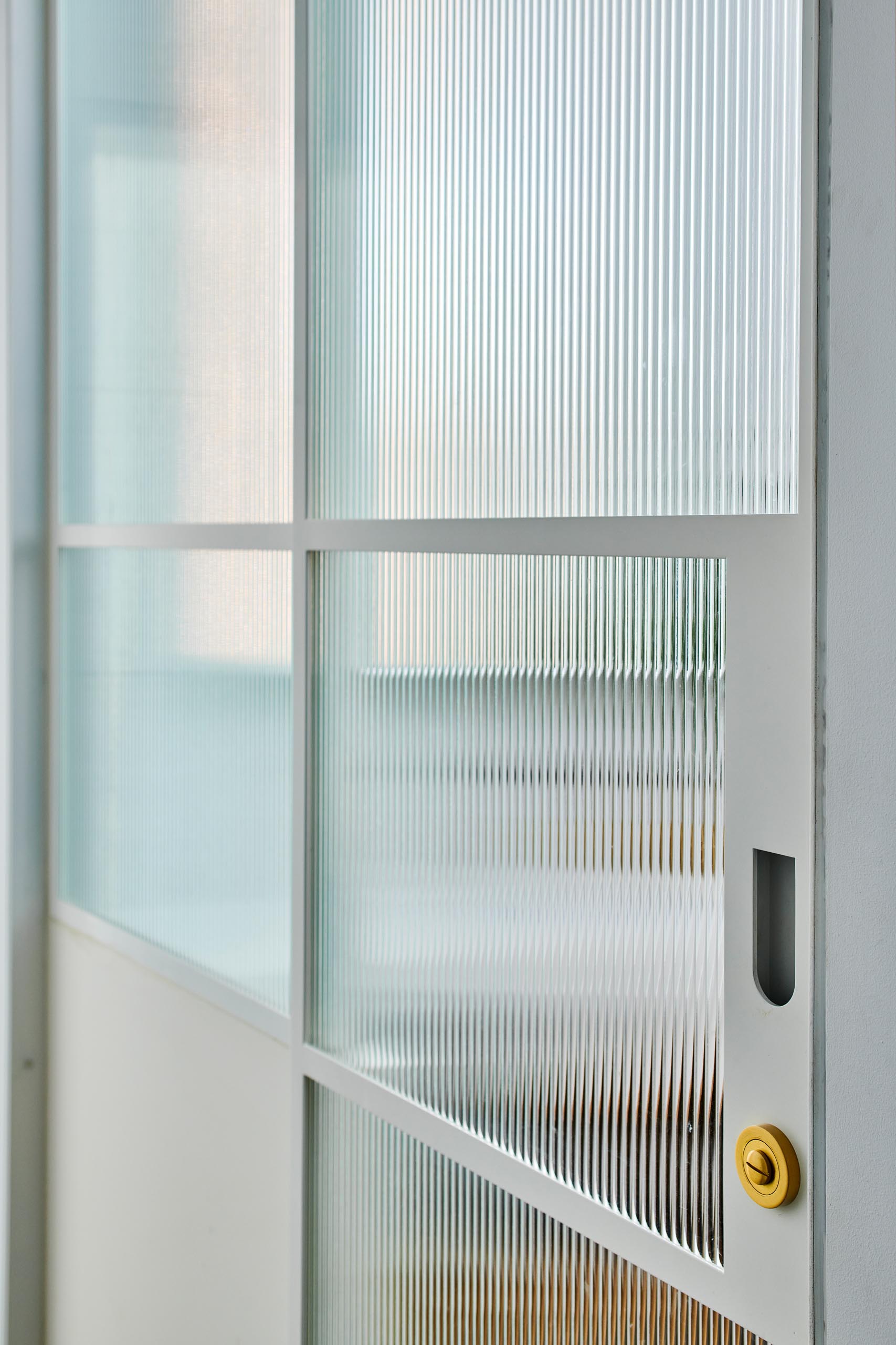 A sliding glass door with texture.