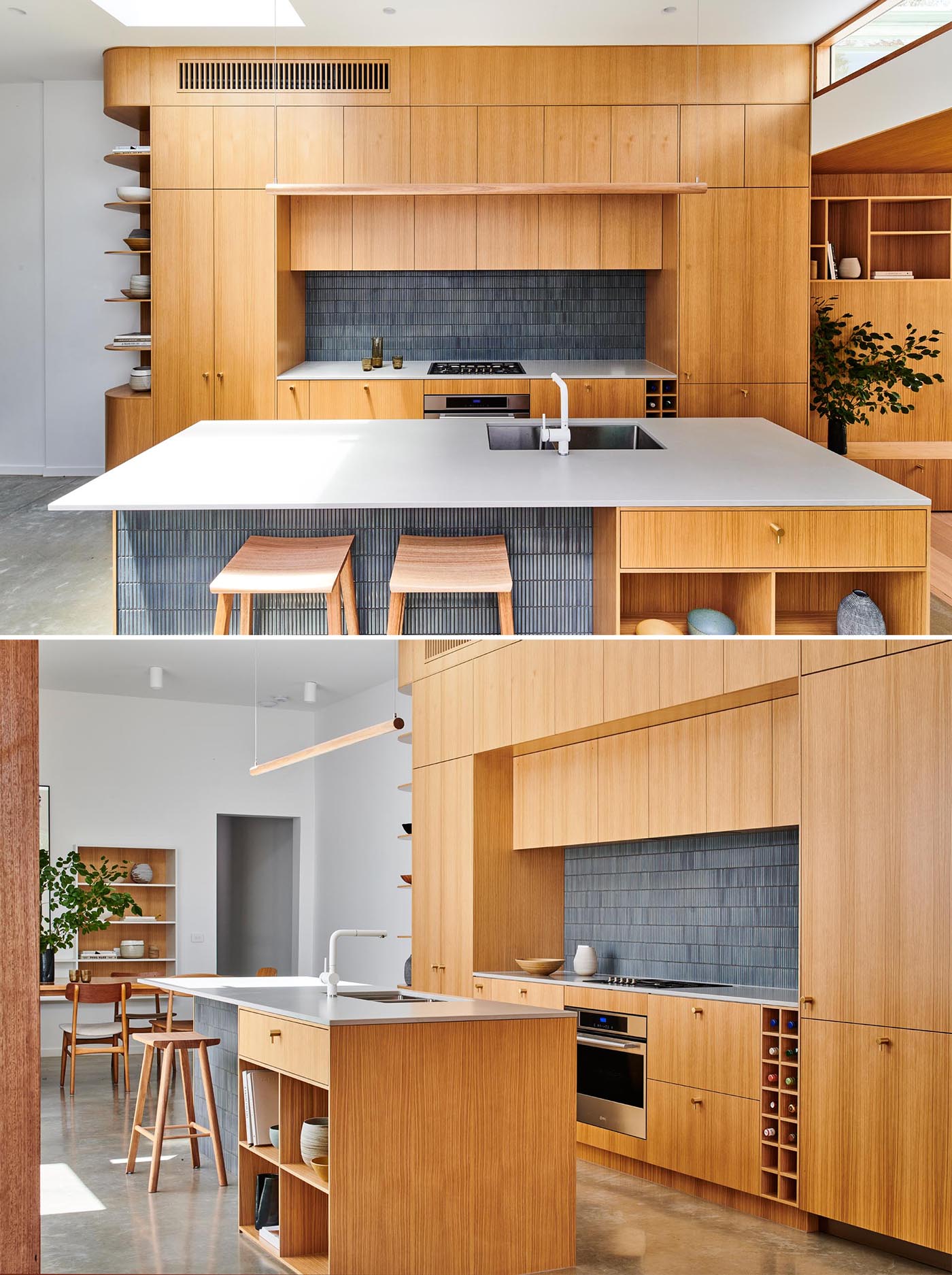 A modern wood kitchen with gray tiles, an island, open shelving, white countertop, and built-in wine storage.