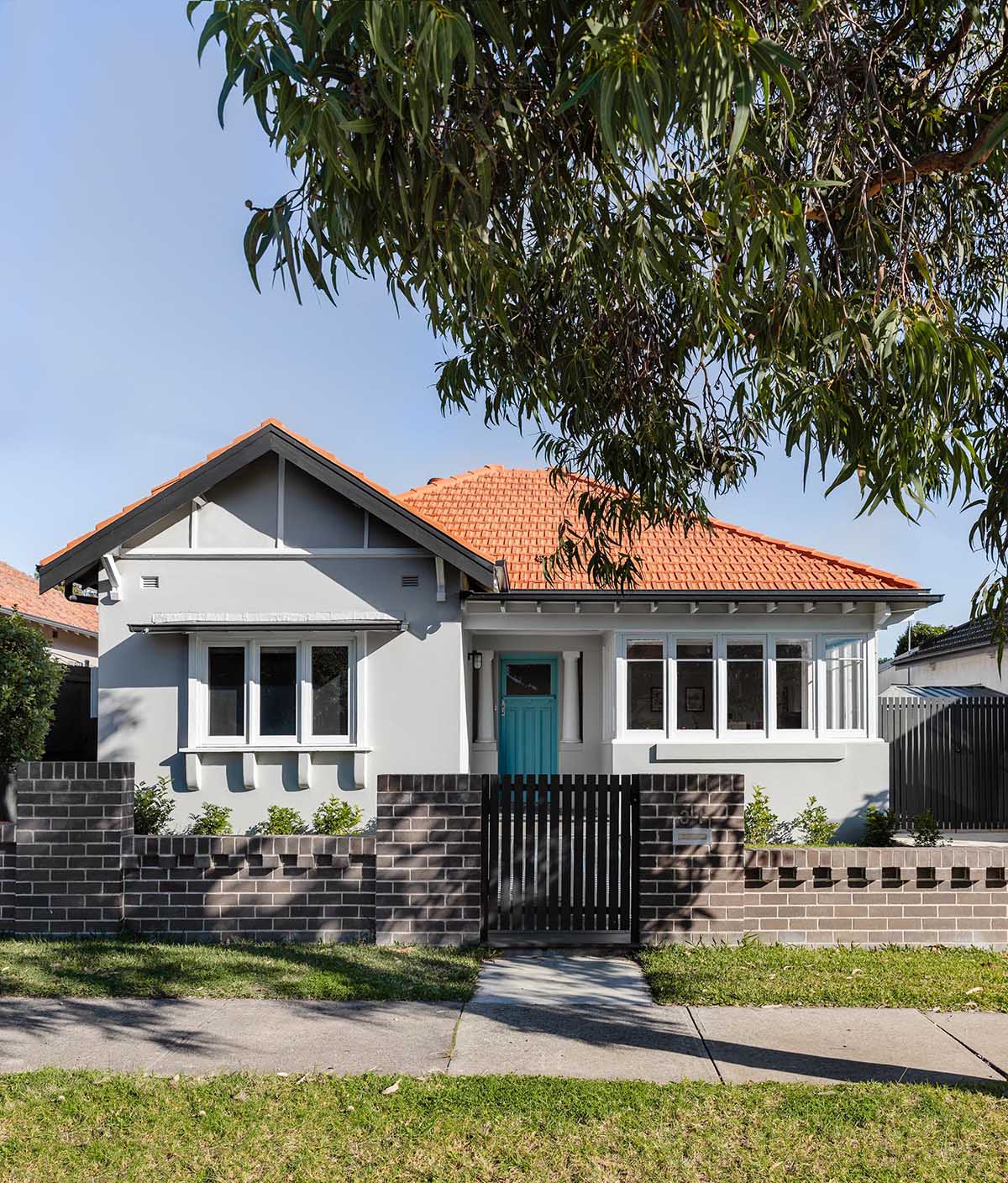 The original front of the house was restored with wide central hallway, which dissected four traditional front rooms. Timber panel detailing, herringbone flooring, timber picture rails and ornate ceilings restored the front of the house to its former glory.