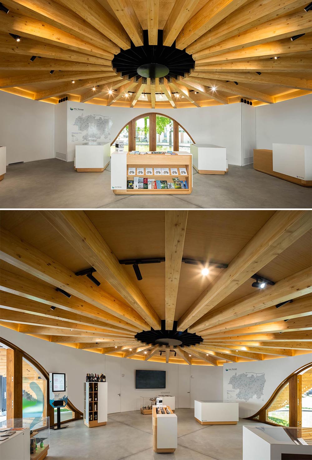 Inside this round building, there's a single open-space room with an exposed wood ceiling,