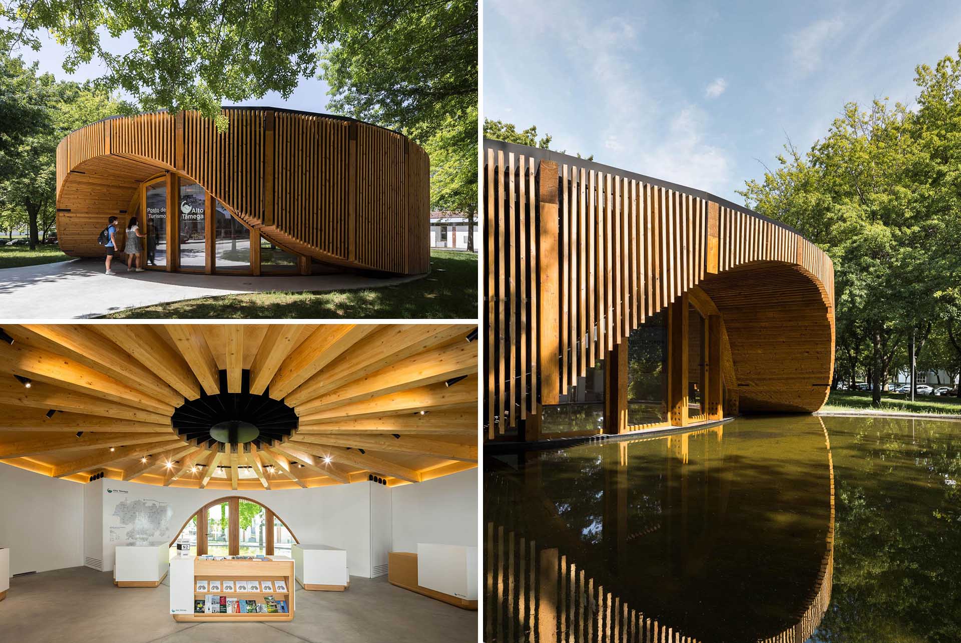 A small modern building has a circular design that's built using a structural base of timber pillars and beams over a concrete slab.
