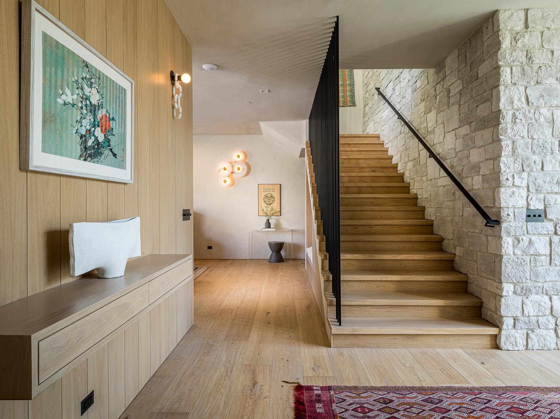 A modern entryway with wide plank white European ¾ oak floors.