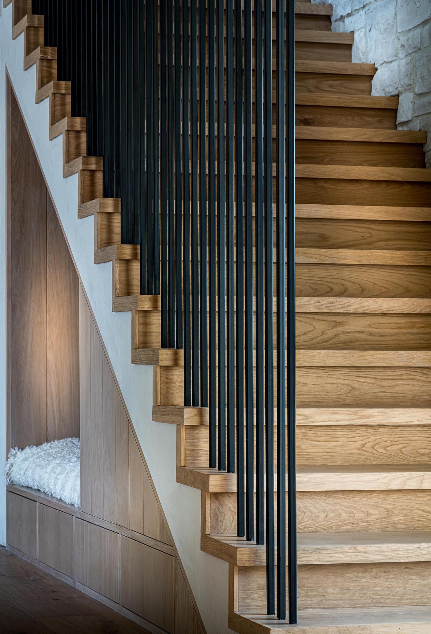 From this angle, which also shows the design of the stairs, you can see how neatly the seating nook and storage is tucked away into the available space.