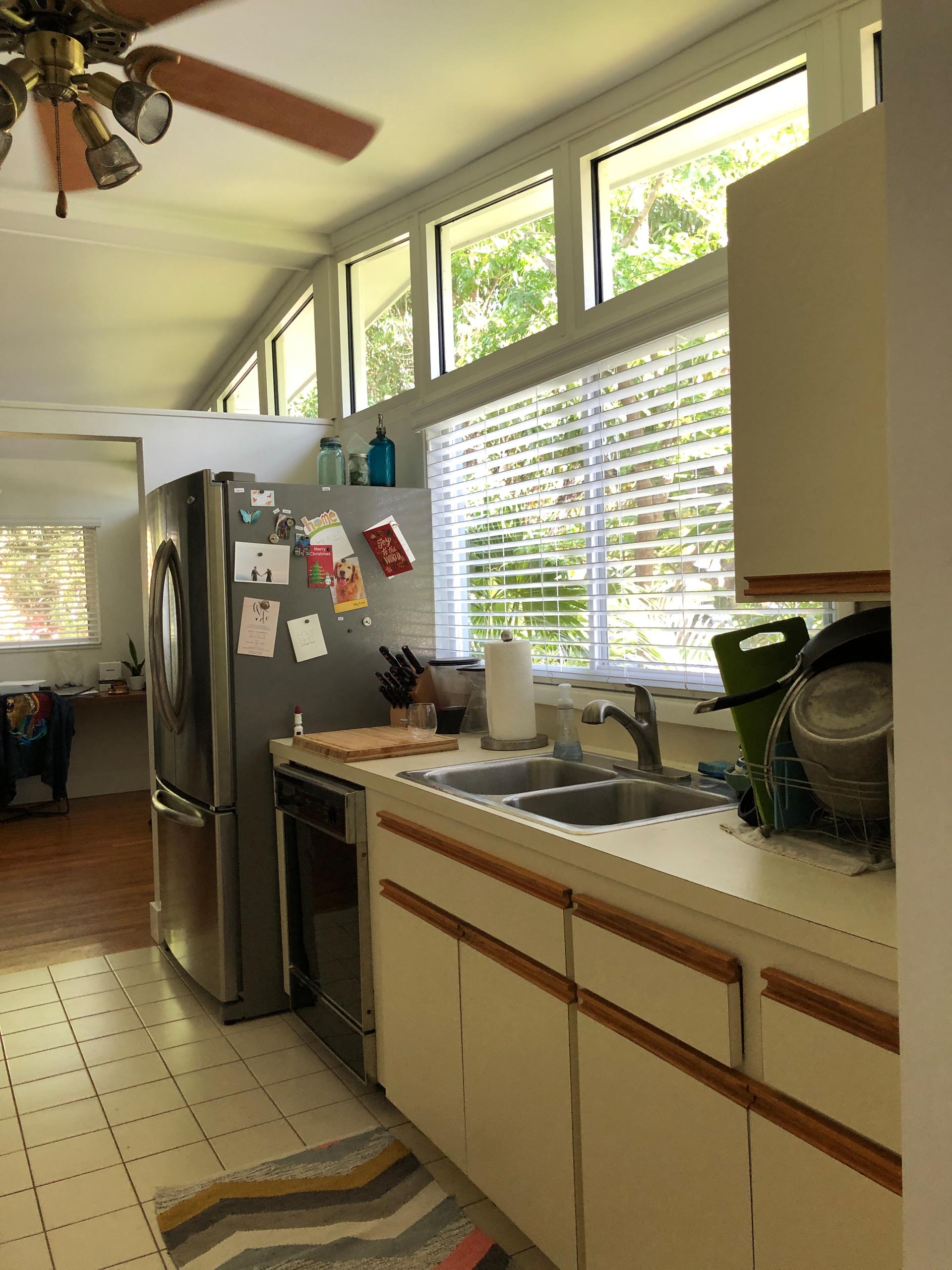 BEFORE - An enclosed and dated kitchen.