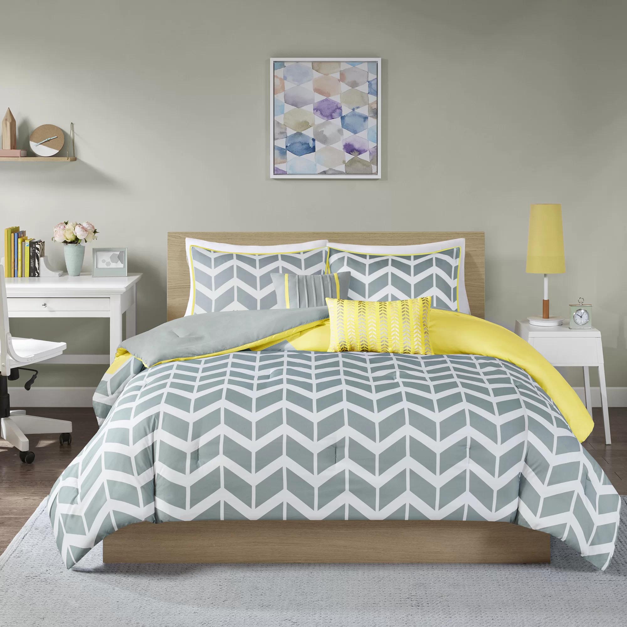 Modern Bedroom Decor - Grey, white, and yellow geometric bedding.