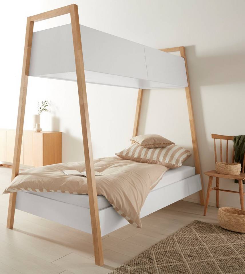 A modern bed design with Nordic influence, includes added storage cabinets above.