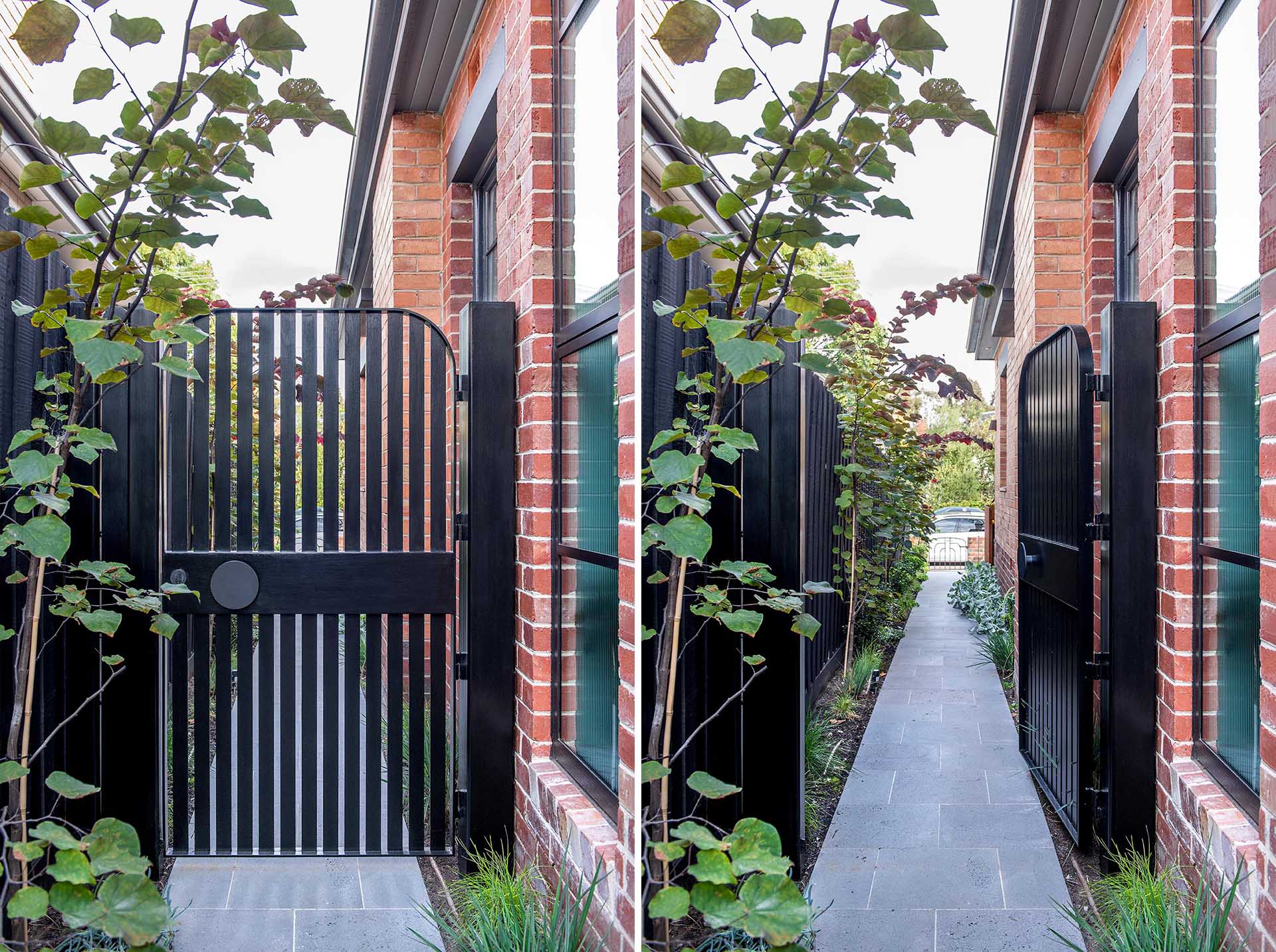 A curved black side gate with a matching round handle.