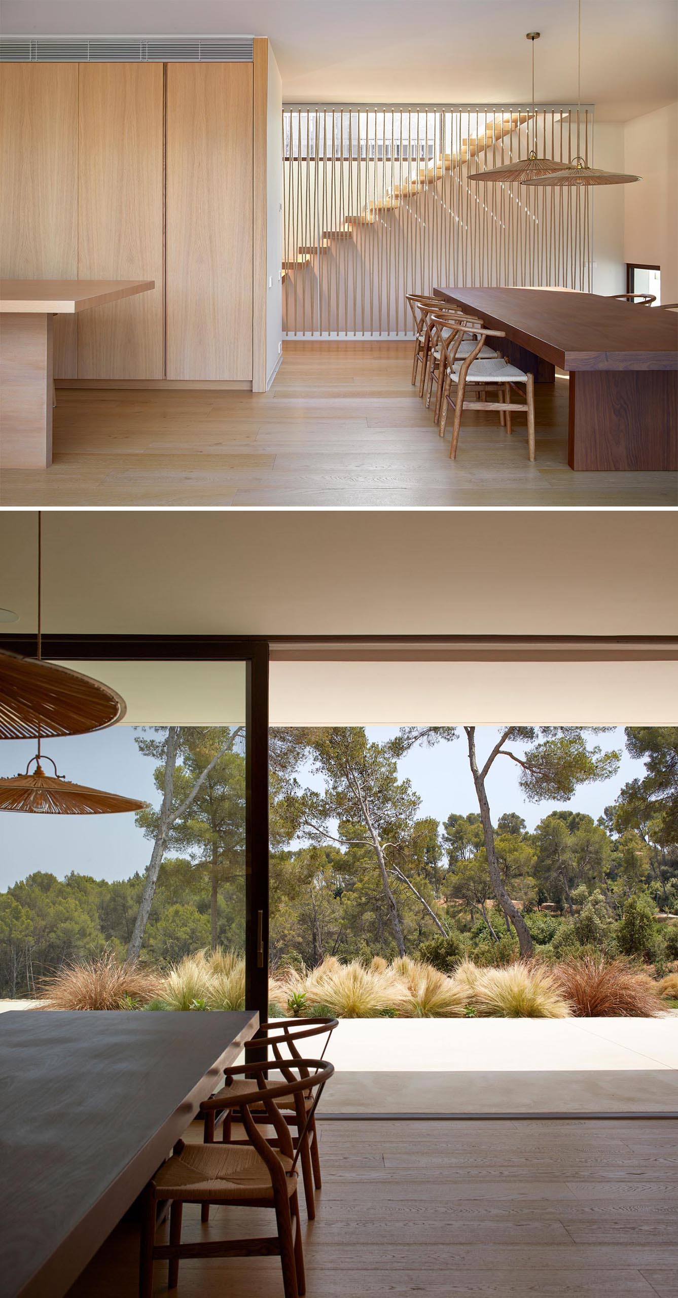 A modern home with a wood and off-white interior opens to a patio via a sliding door.