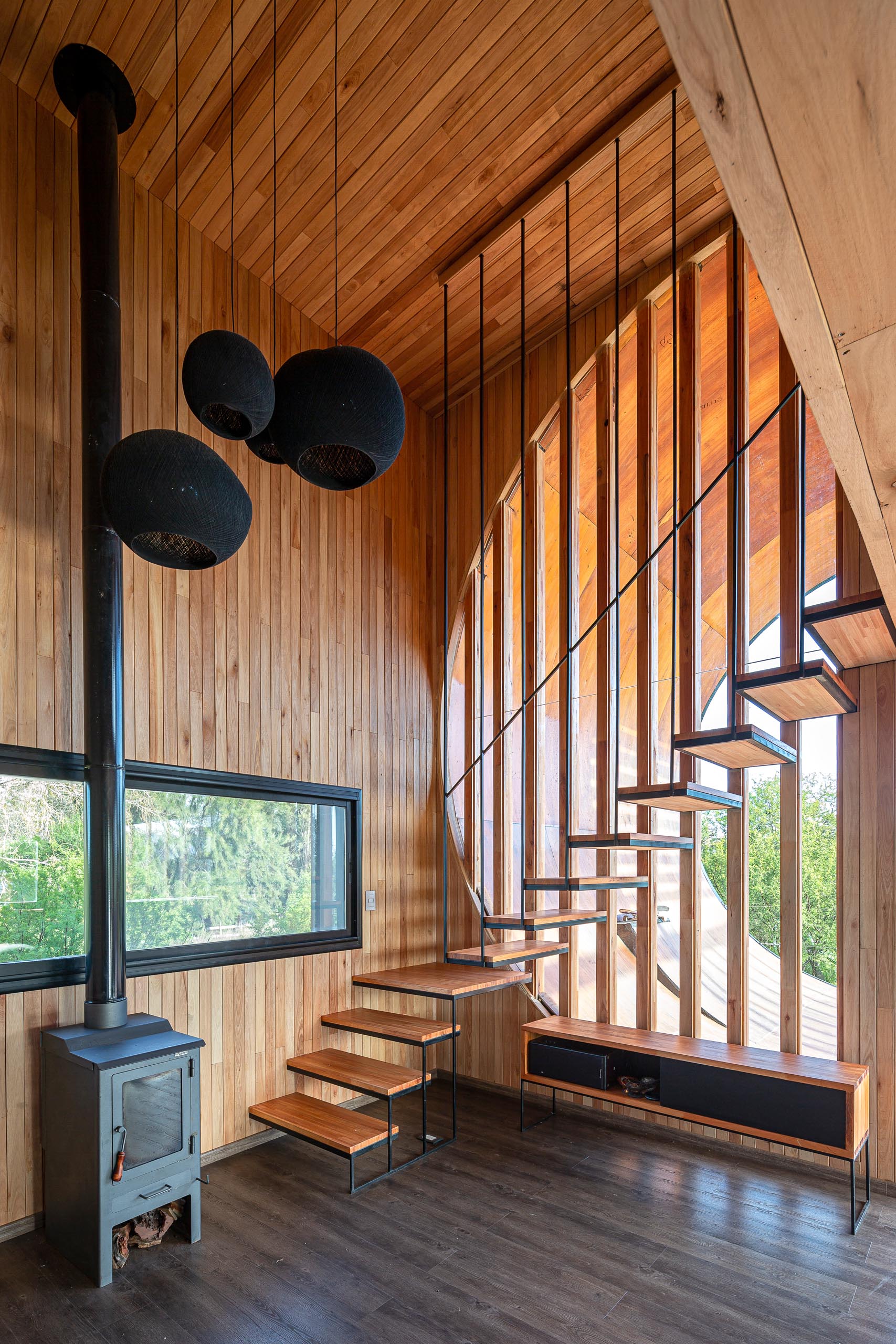 A small and modern house with a built-in skateboard ramp.