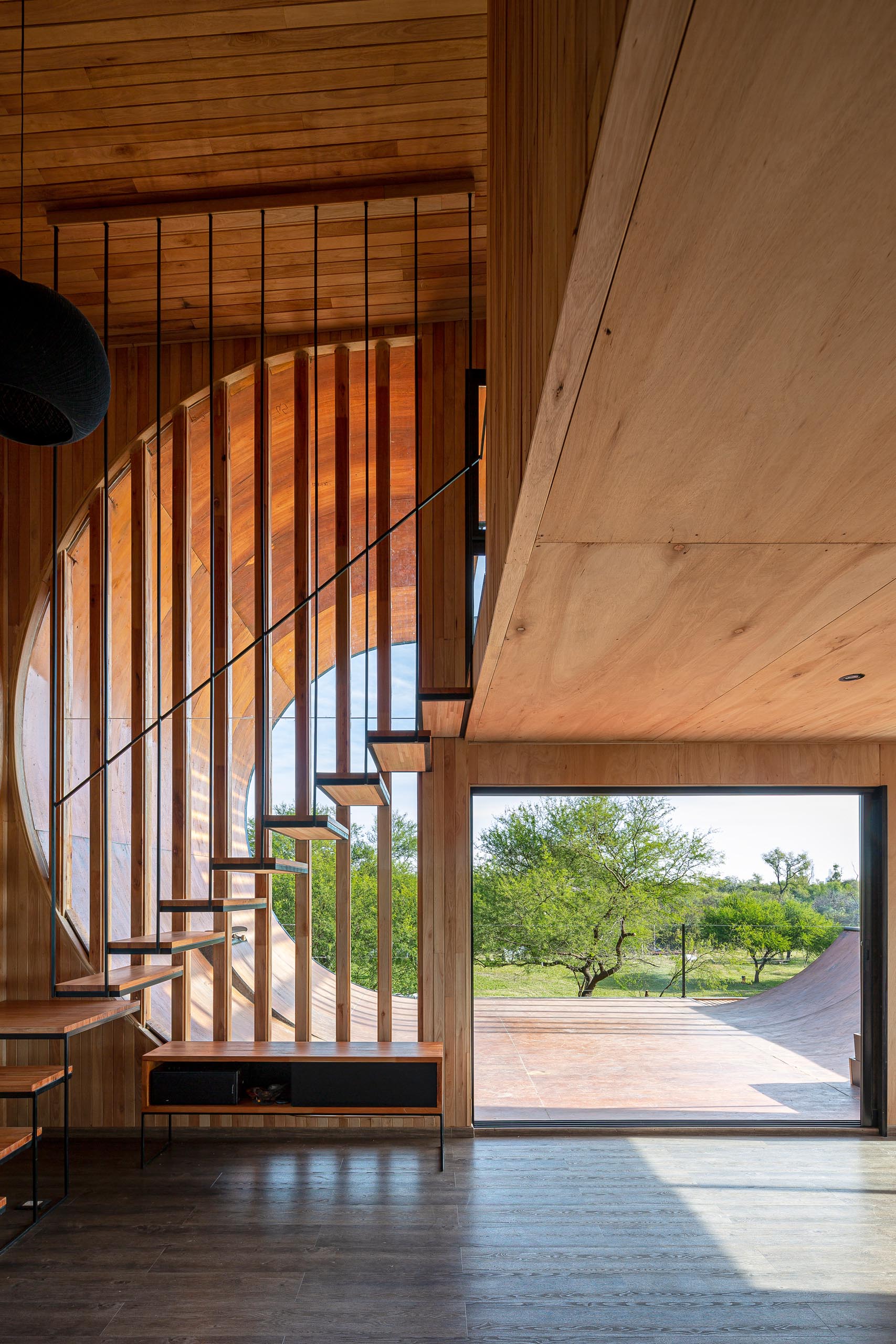 A small and modern house with a built-in skateboard ramp.