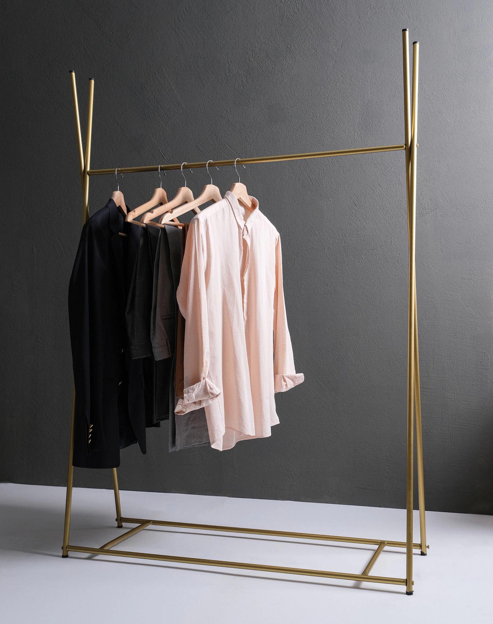 Storage Idea - Modern freestanding gold clothes rack.