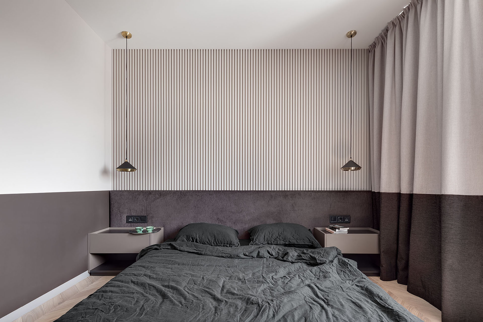 A two-tone bedroom includes different shades of chocolate and beige.