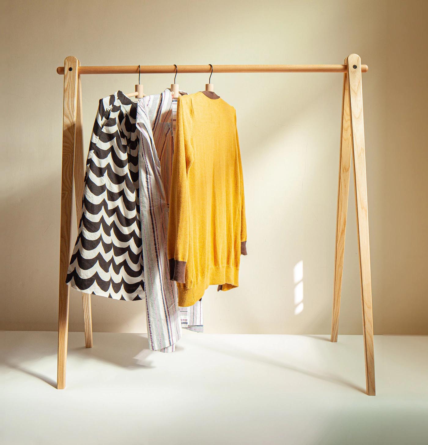 Storage Idea - Modern freestanding wood clothes rack.