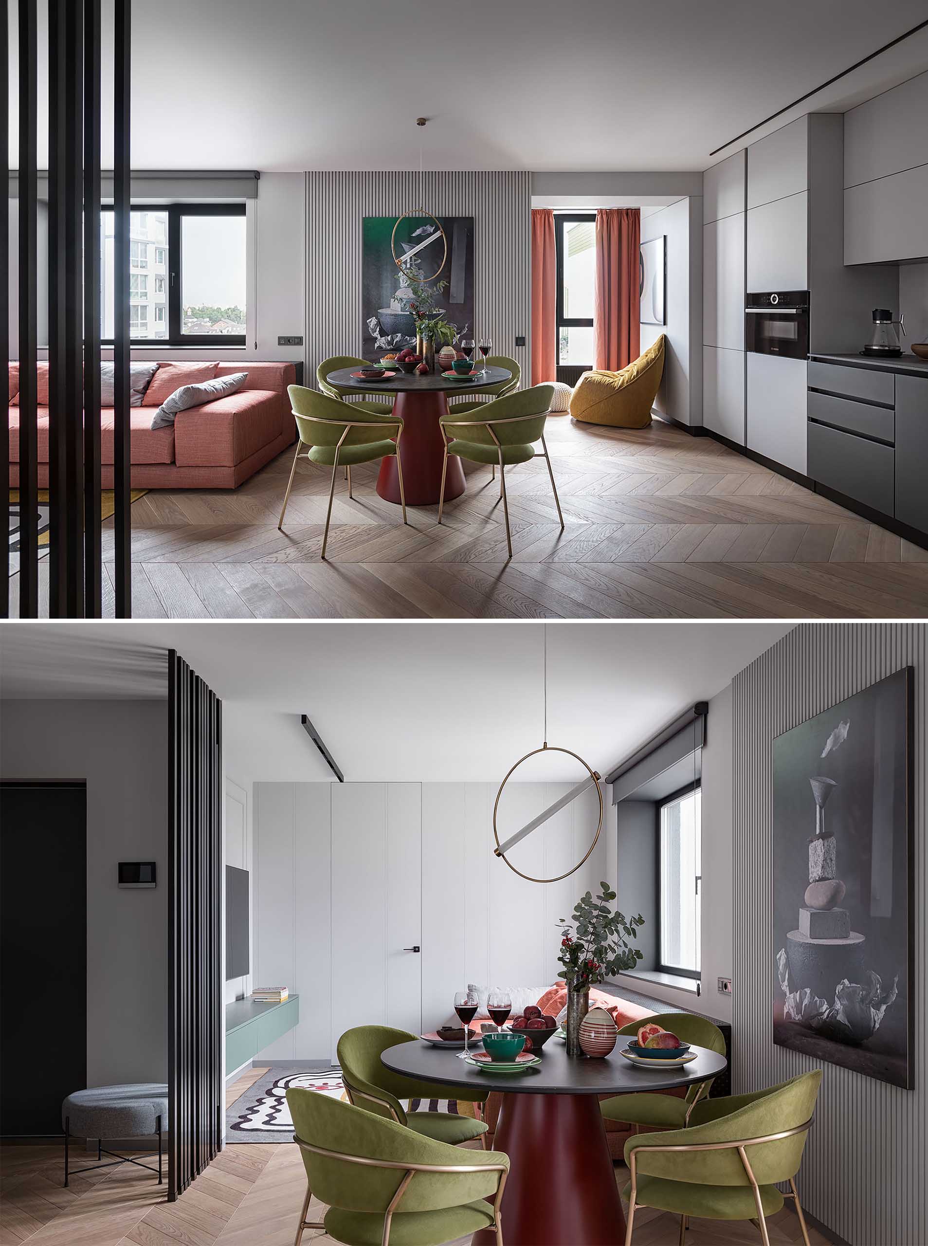 Separating the living space from the kitchen is a round dining table, a minimalist pendant light, and chairs with metallic frames.