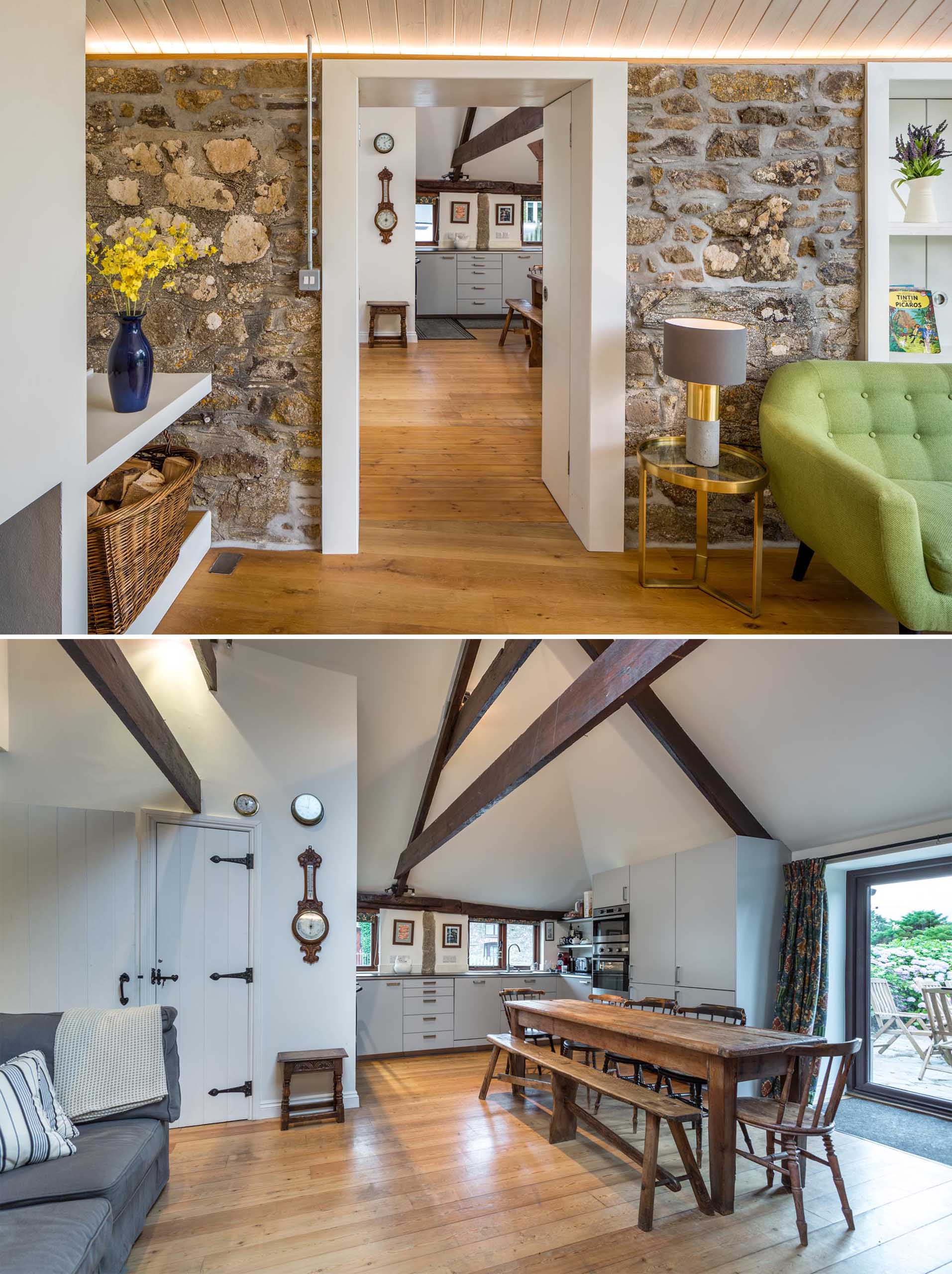 In this kitchen, accessed through an opening in a stone wall, dark wood beams draw the eye upwards to the high ceiling.