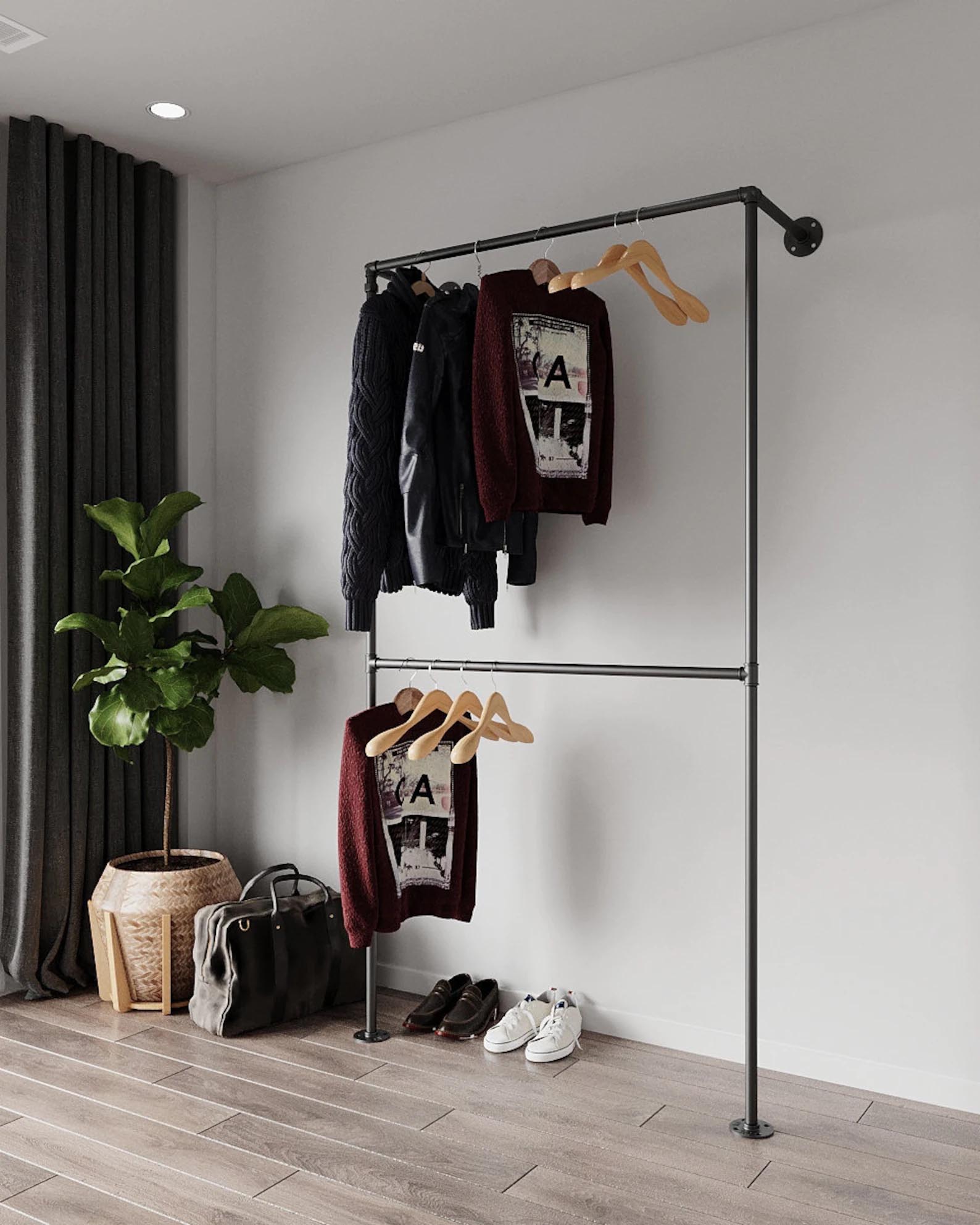 Storage Idea - Modern wall mounted black metal clothes rack.