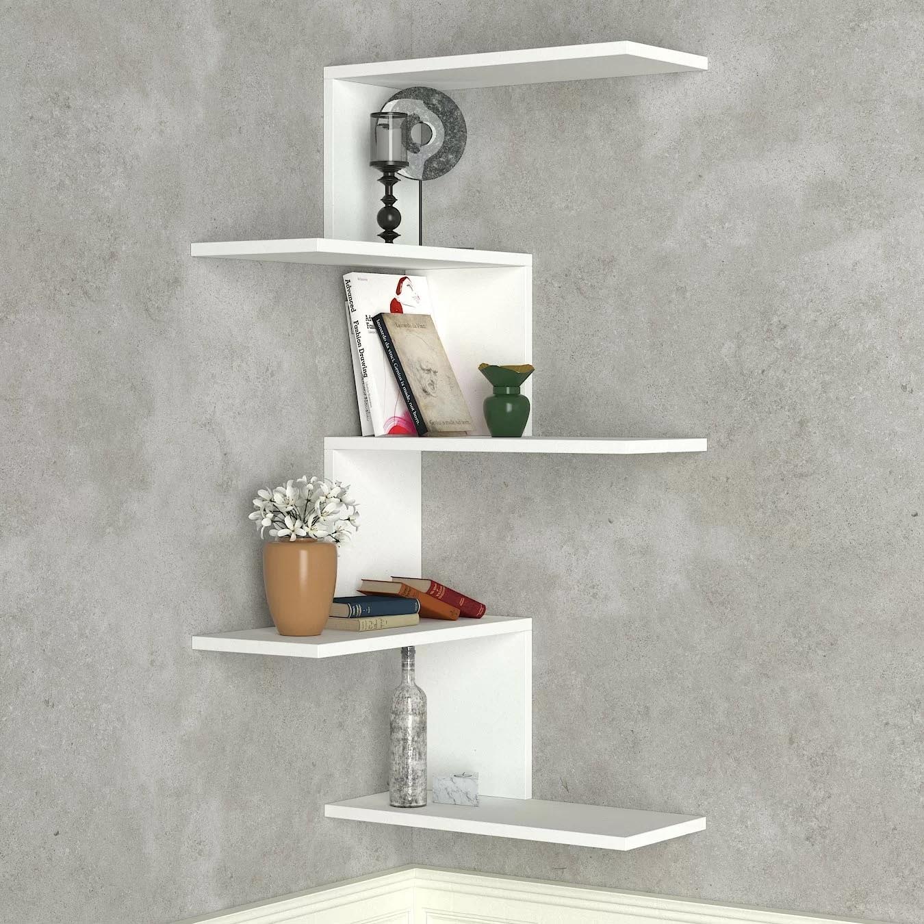 Corner Shelf Ideas - A modern white corner shelf with multiple levels.