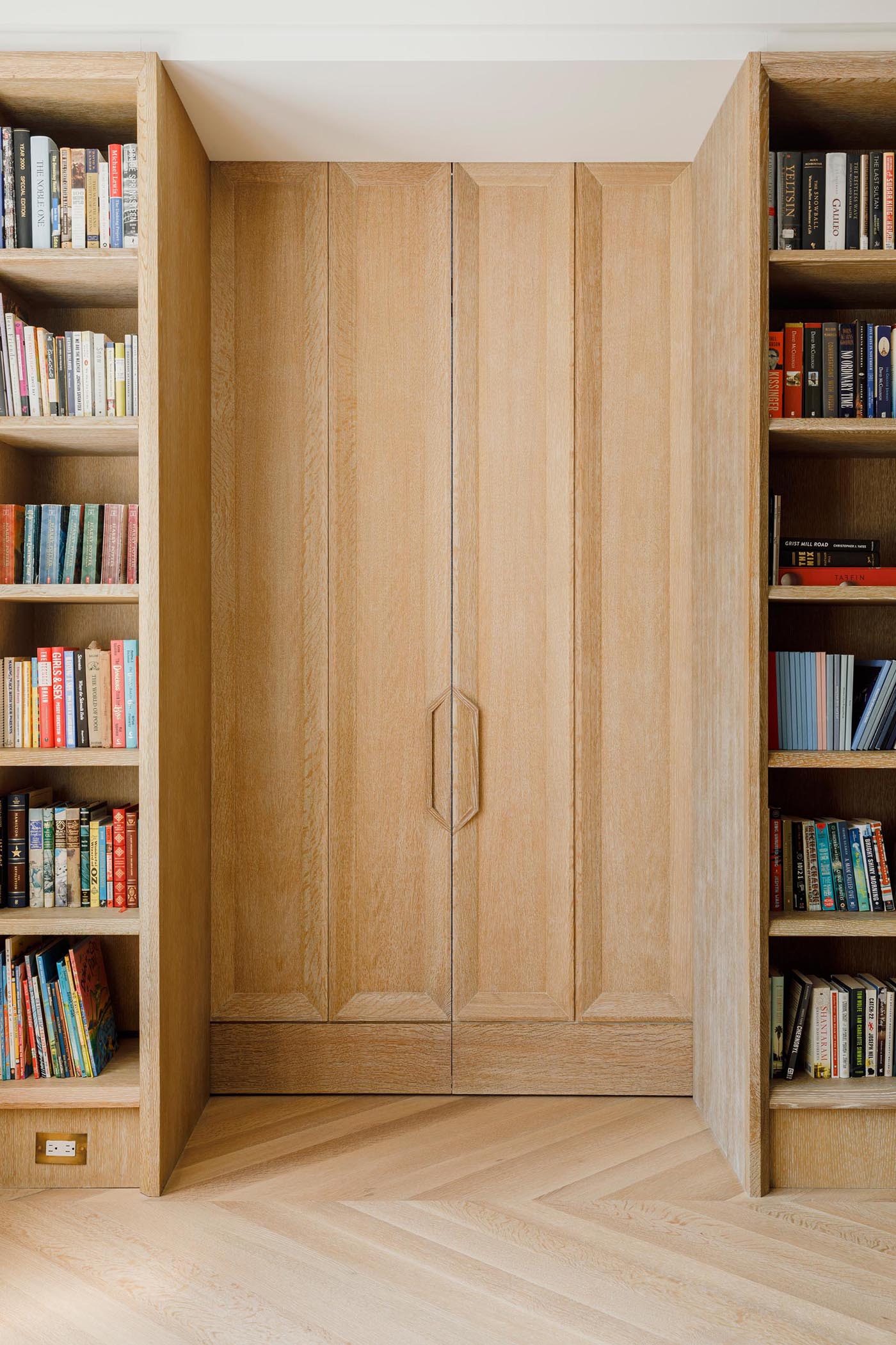 The living room is hidden behind integrated pocketing doors on harmon hinges. 