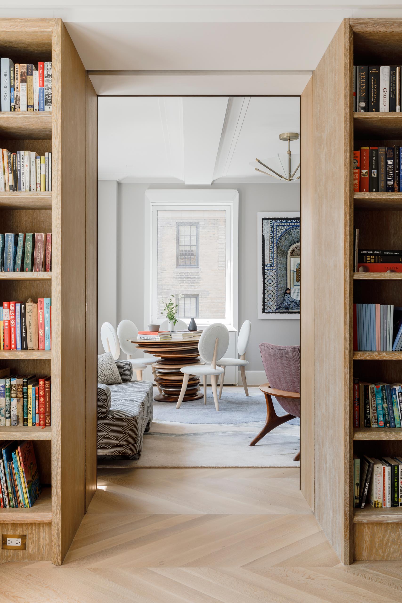 The living room is hidden behind integrated pocketing doors on harmon hinges. 