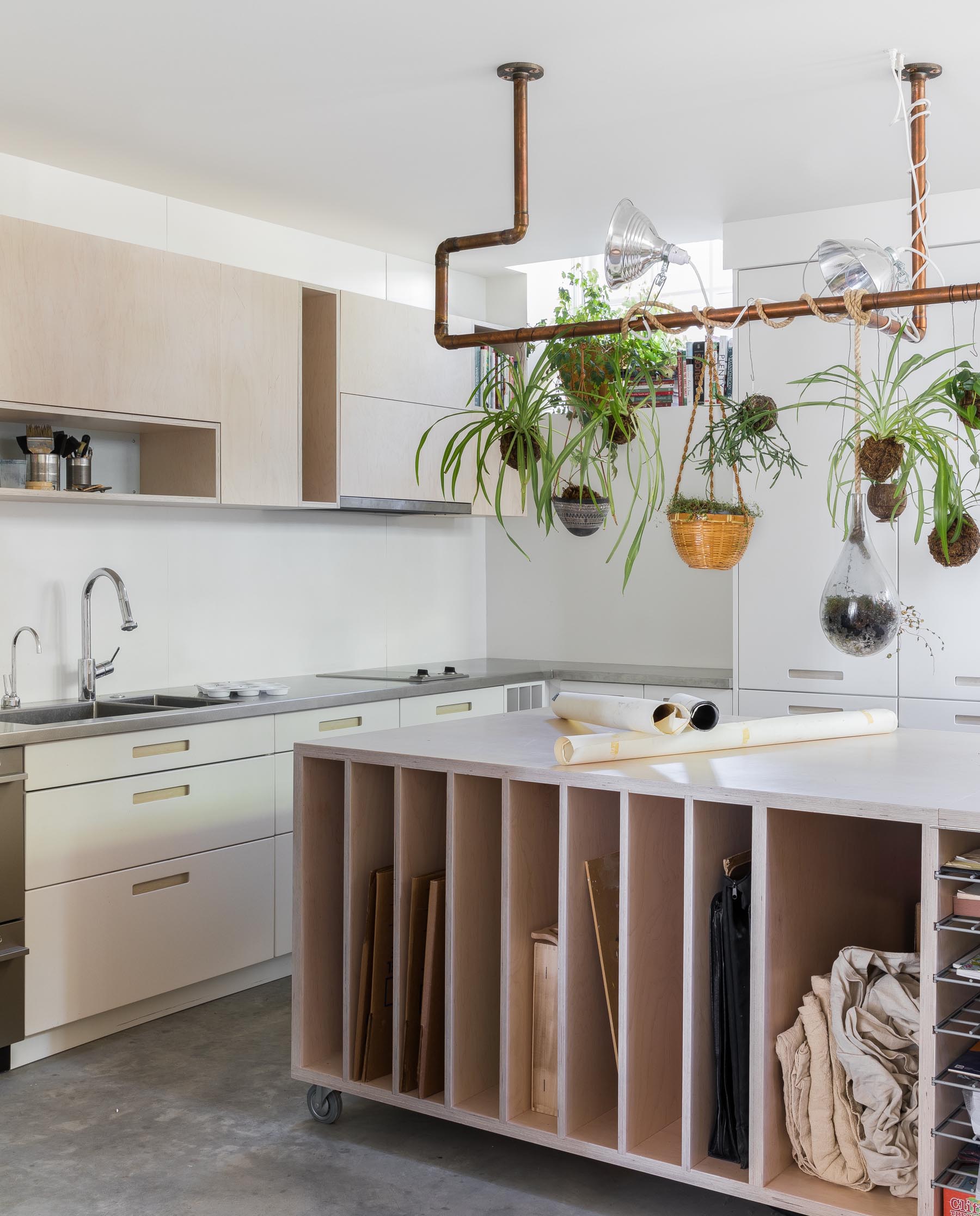 A contemporary art studio with a kitchen.