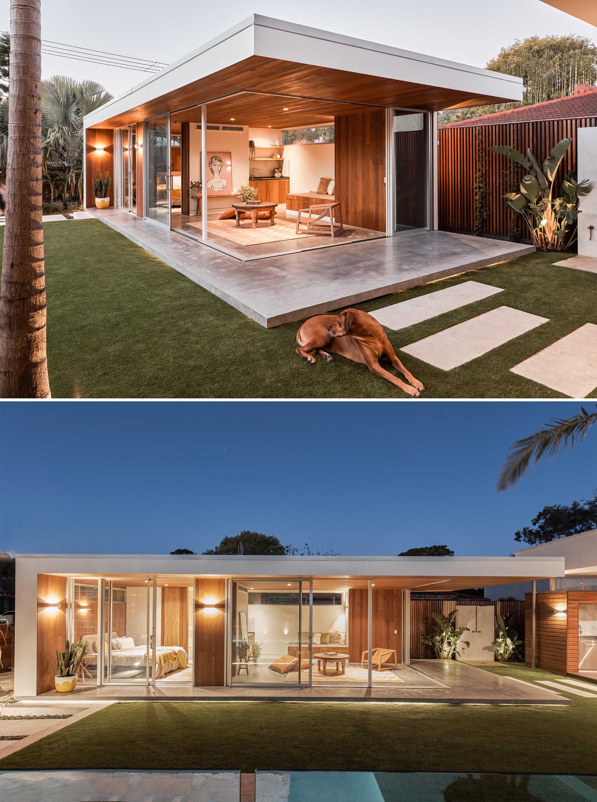 With mid-century modern influences, the sliding glass walls of this backyard studio, seamlessly open the interior spaces of the studio to the backyard. Inside, there's a wood ceiling, polished concrete floors, a small bench, storage, and a kitchenette.