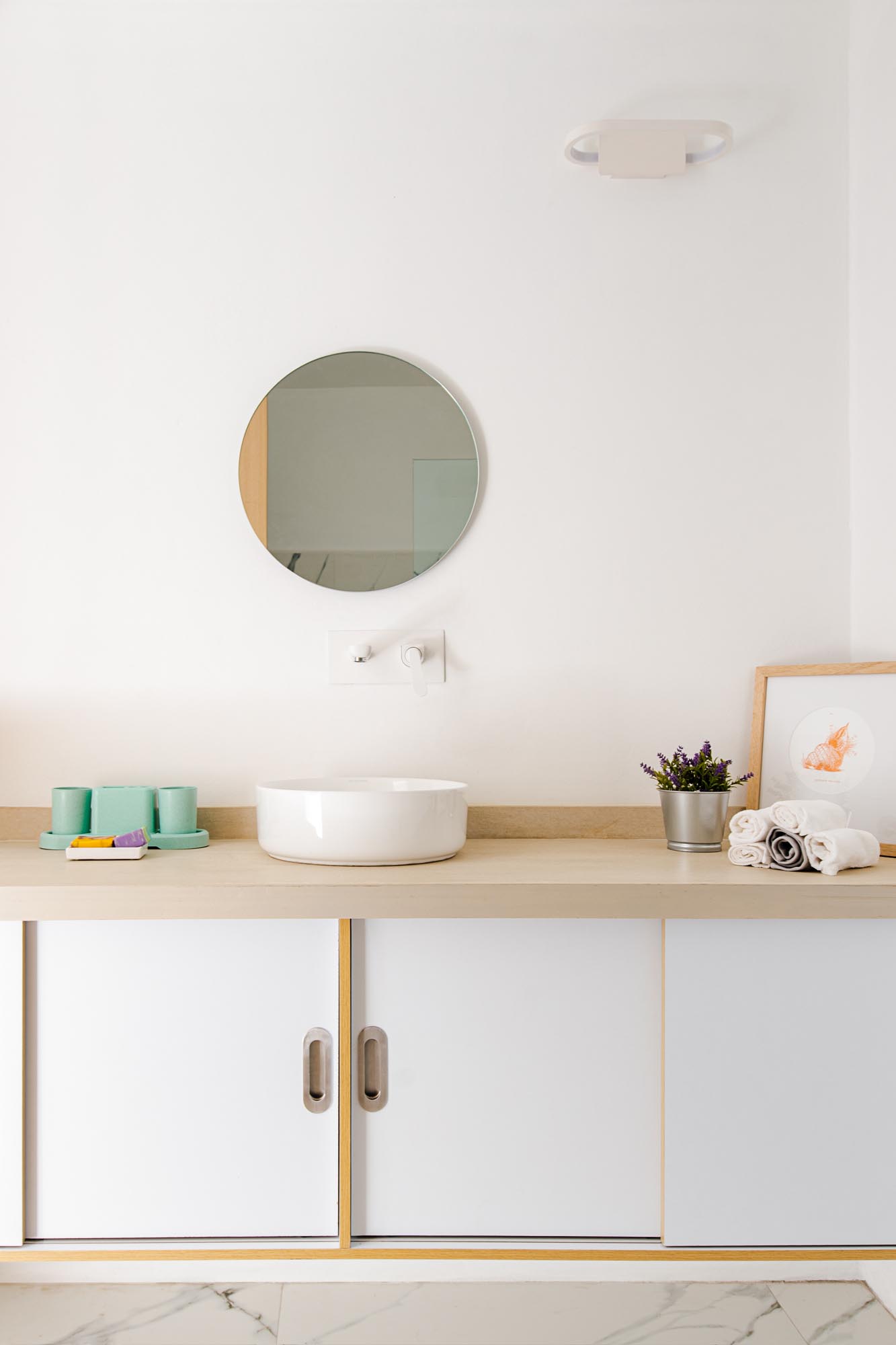 A modern bathroom with a built-in vanity.