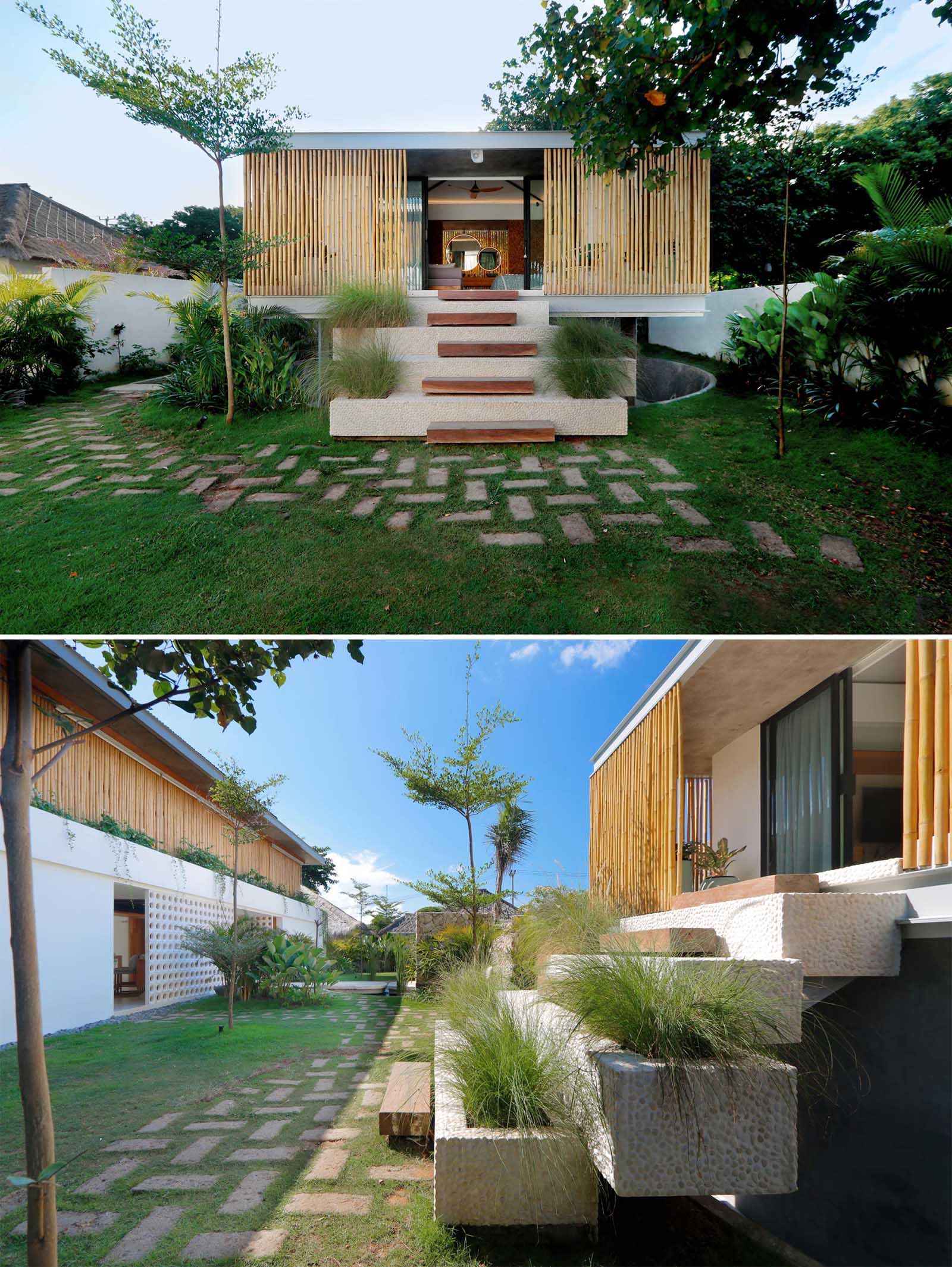 A modern beach home with a a white exterior and interior, includes bamboo screens for privacy and shade.