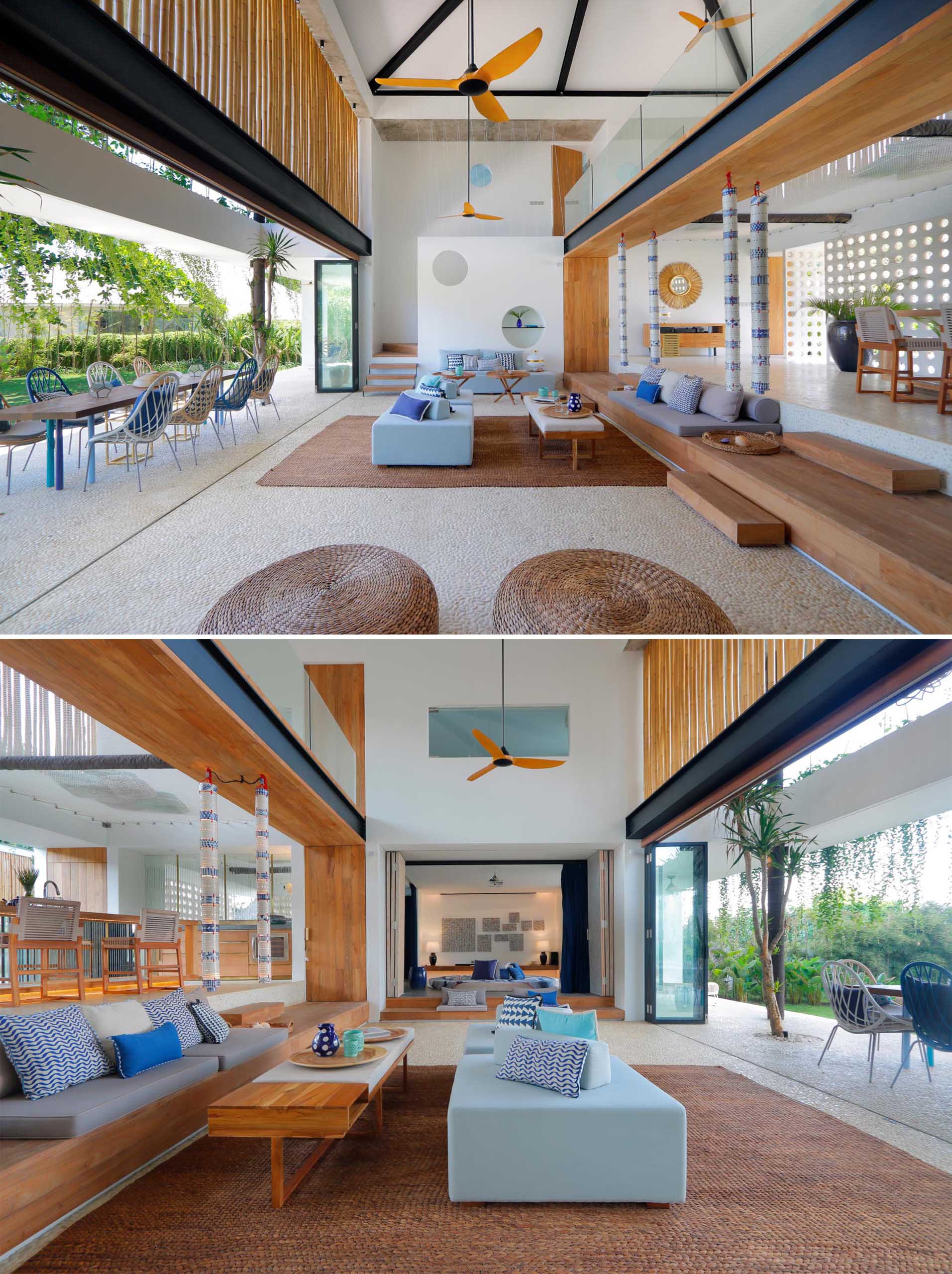 A modern beach house interior with an open living room and double height ceiling.
