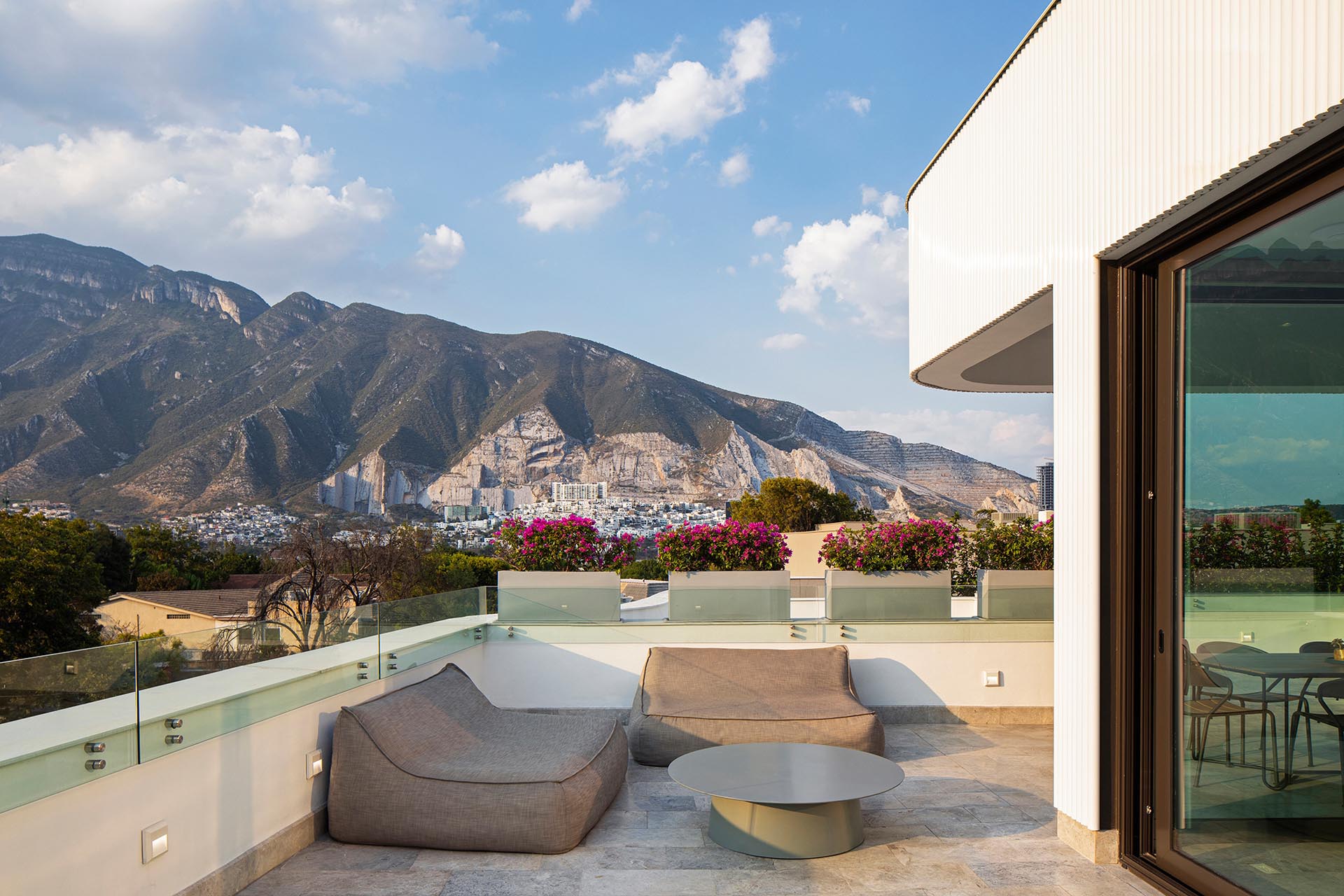 This modern rooftop terrace provides a relaxing place for mountain views.