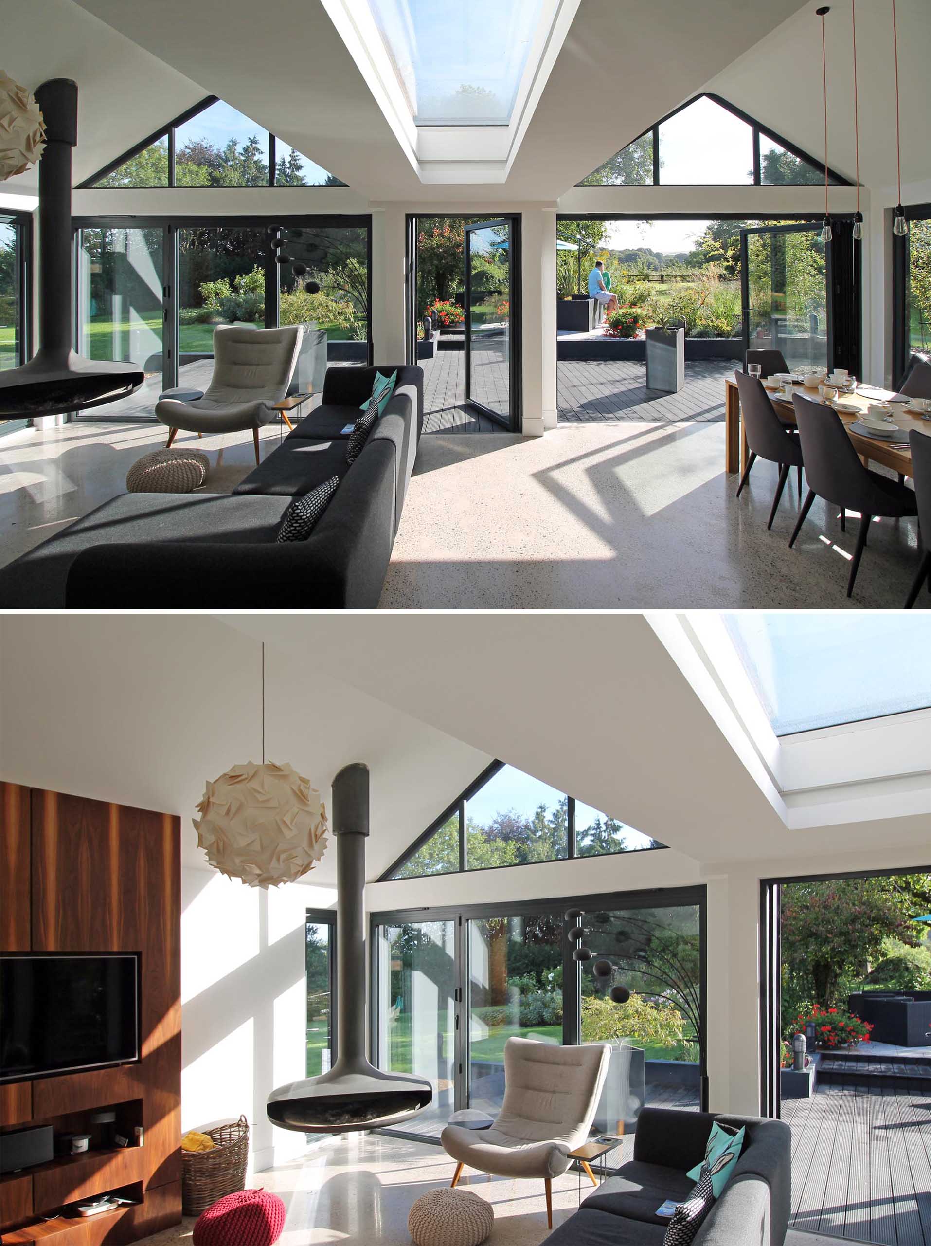 Inside this modern extension, the pitched roofs are open and each roof defines a zone in the open plan space below, like the living room and dining area.