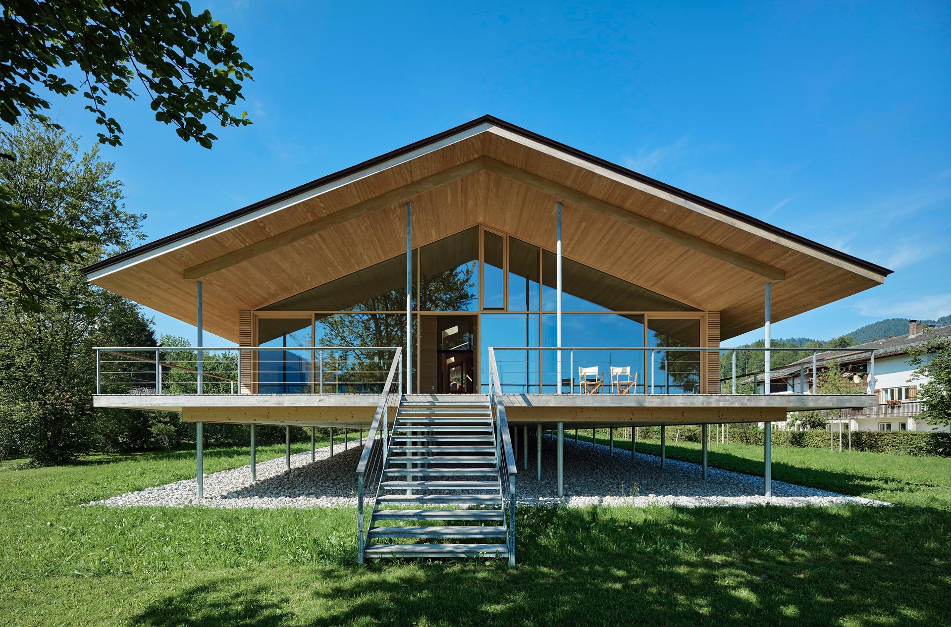 The timber construction of this modern house was mostly made from local woods, and is elevated on stilts to protect it from flood.